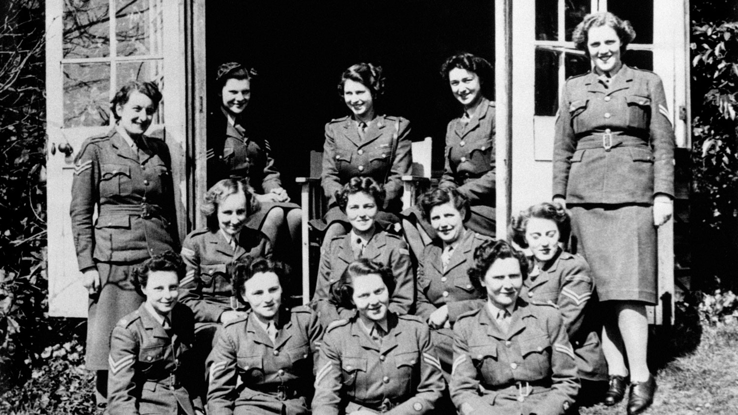 Princess Elizabeth (top centre) in a group photograph with Senior and Junior Non Commissioned Officers on her course at No 1 MTTC at Camberley, Surrey 1944