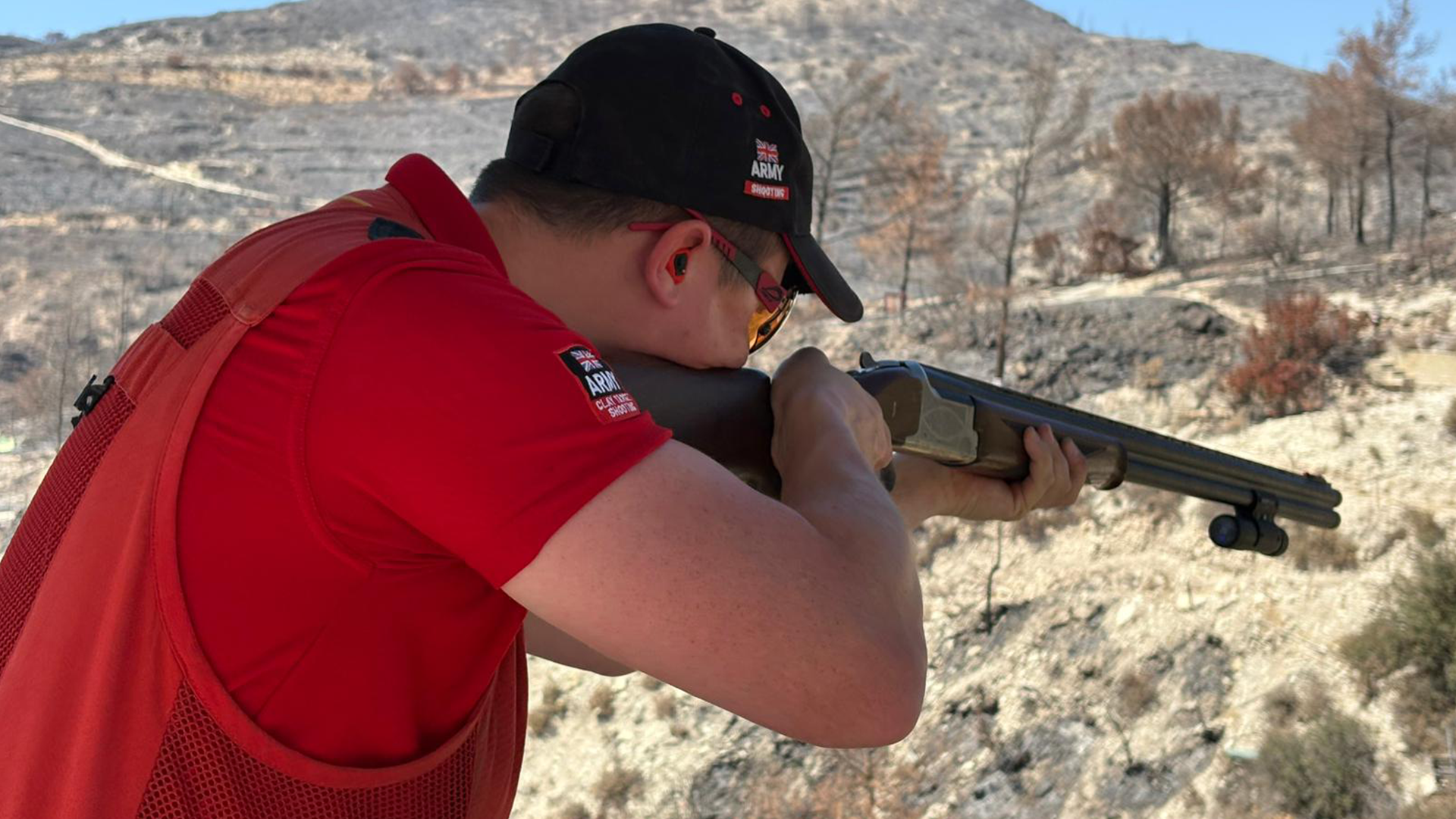 A member of the Army's Clay Target Shooting team shows off his skills in Cyprus