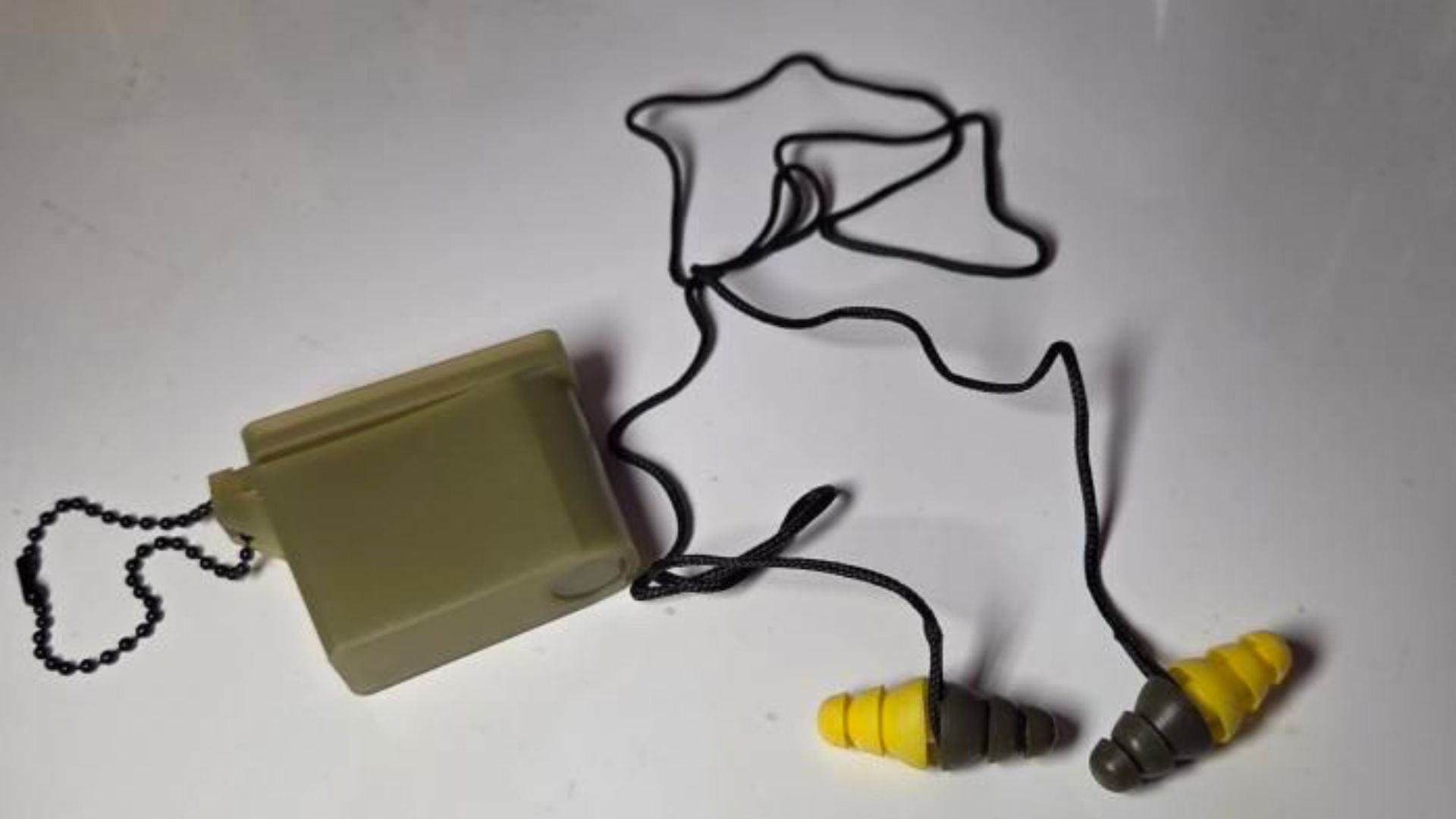 The combat ear plugs dual ended design was intended to block out most, while still letting in spoken command