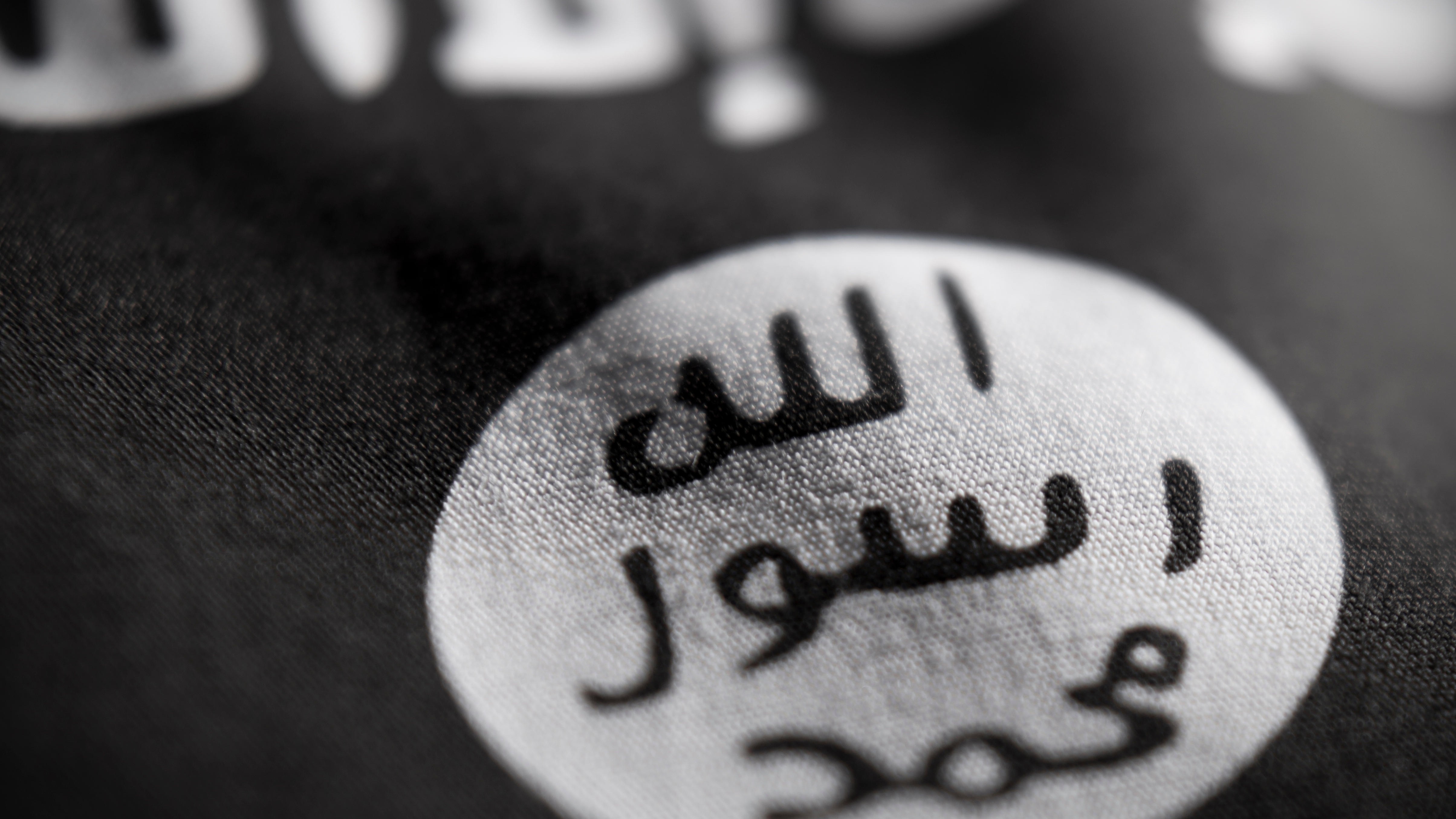 Abstract macro view of ISIS flag with shallow depth of field (Picture: Alamy)