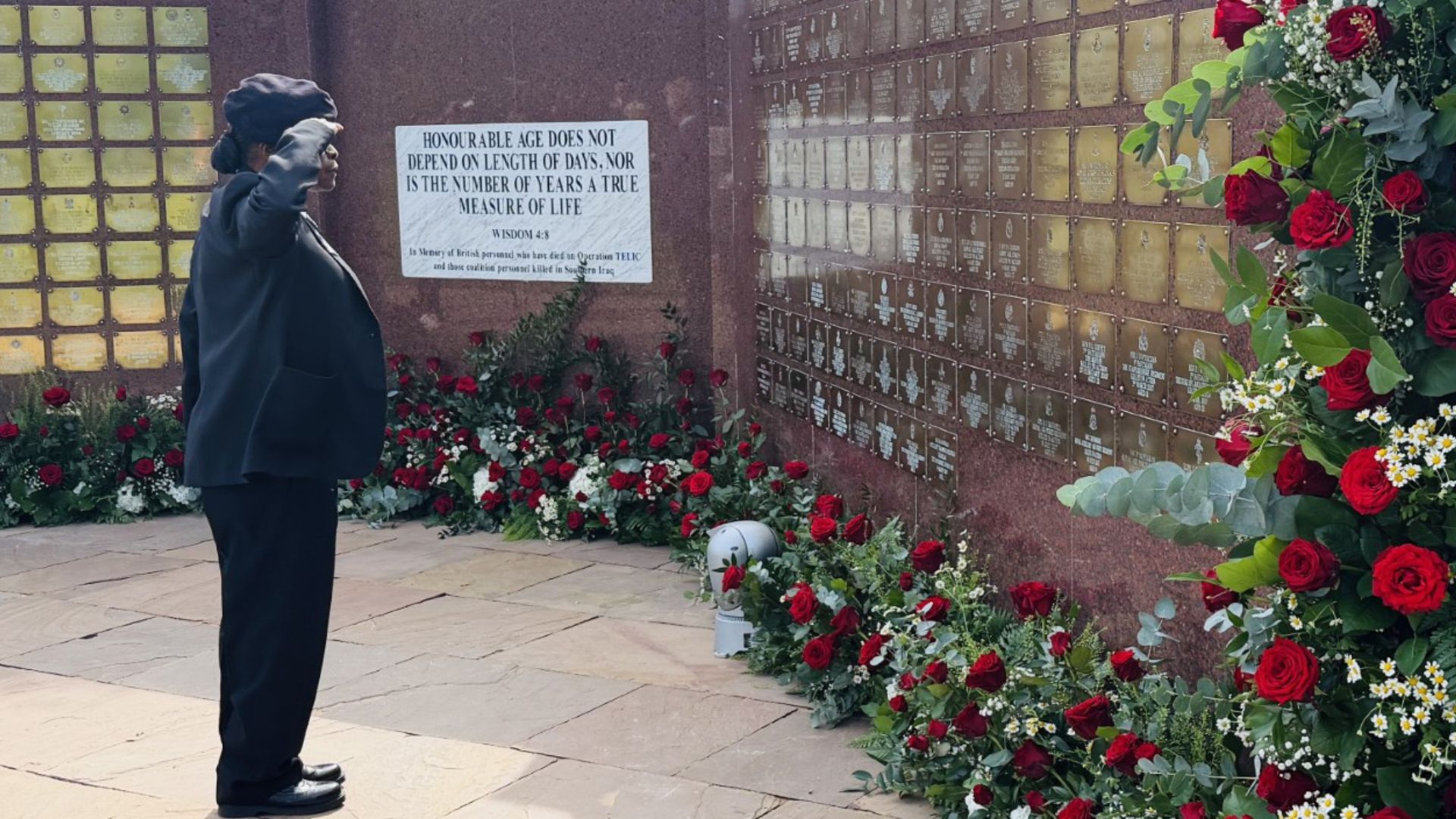Ms Anne-Mitchell is pictured at the Basra Memorial Wall, where the names of those who lost their lives are inscribed (Picture: BFBS)