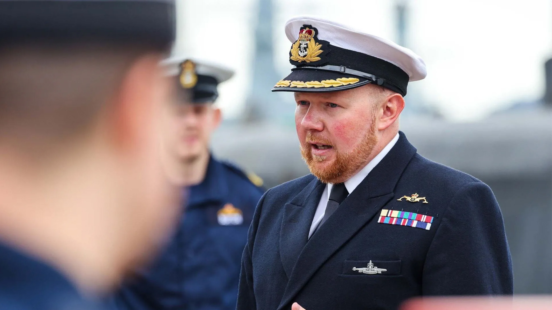 Commander Chris Bate bids farewell to the crew of HMS Astute