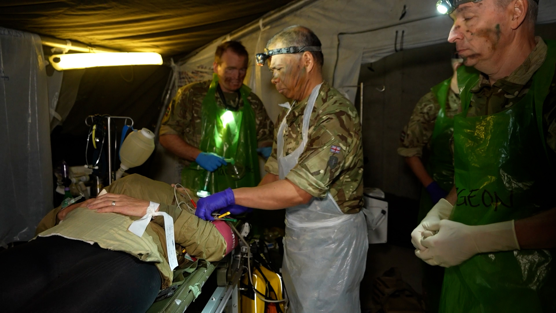 Medics treat a simulated casualty closer to the frontline than they would have done back in the 1980s