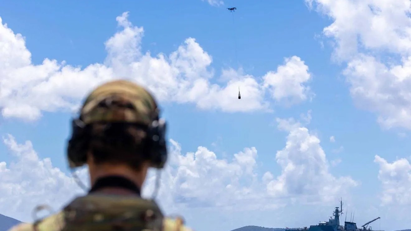 A member of 700X Naval Air Squadron quides the Malloy T150 from HMS Trent to shore (Picture: MOD)