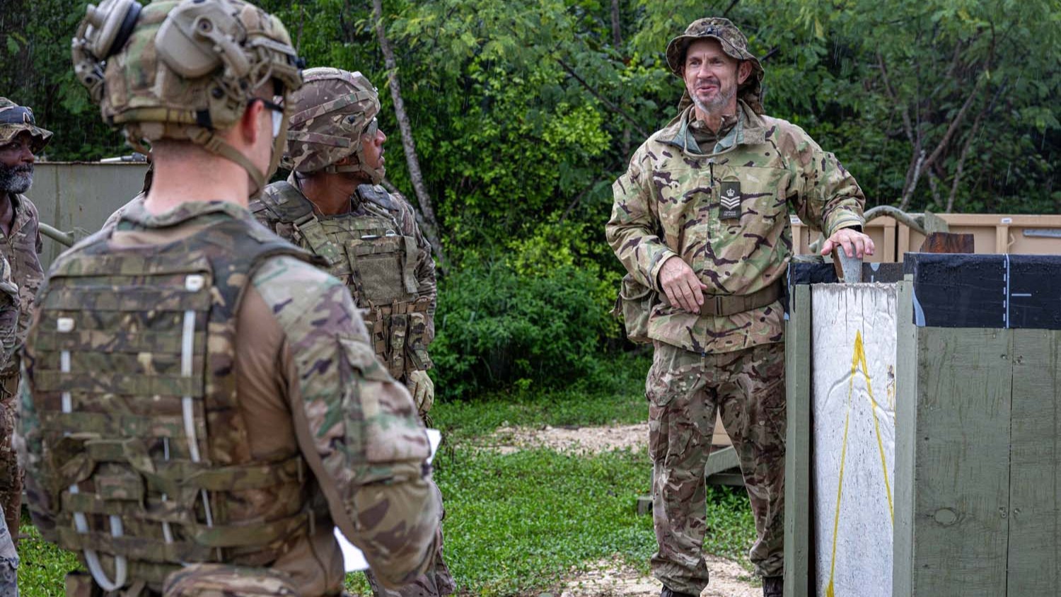 An instructor briefs personnel on structural breaching techniques during urban search and rescue training in the Cayman Islands pic MOD