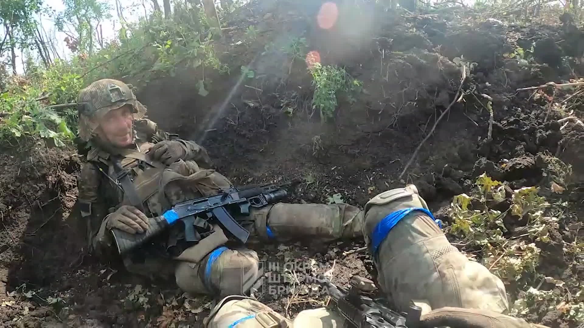 While earth banks like this have always offered soldiers limited cover from incoming fire, they now need to be aware of overhead cover amid the threat from drones, exposing themselves for the minimum amount of time