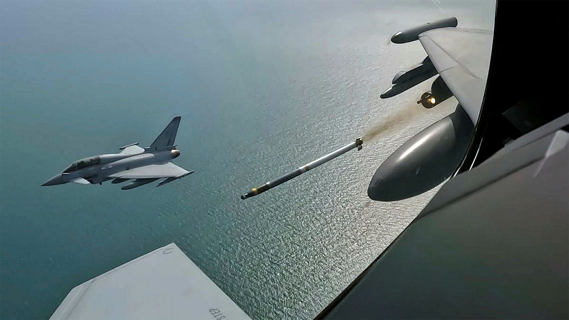 The crew of a two-seat Typhoon observe the firing of a rocket fitted with the Advanced Precision Kill Weapon System, turning it into a guided missile (Picture: MOD)