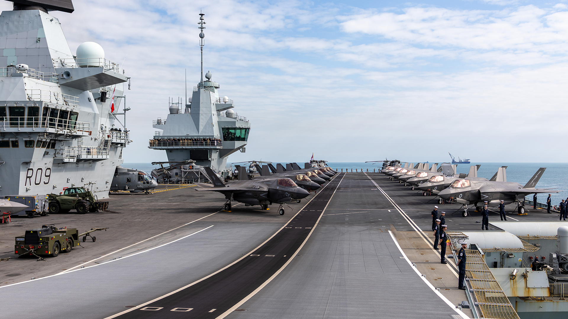 The carrier shows off her complement of F-35s - now complete once more - and Merlins