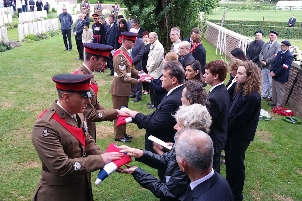23rd Battalion present Union Flags at burial service for WWI soldiers in France