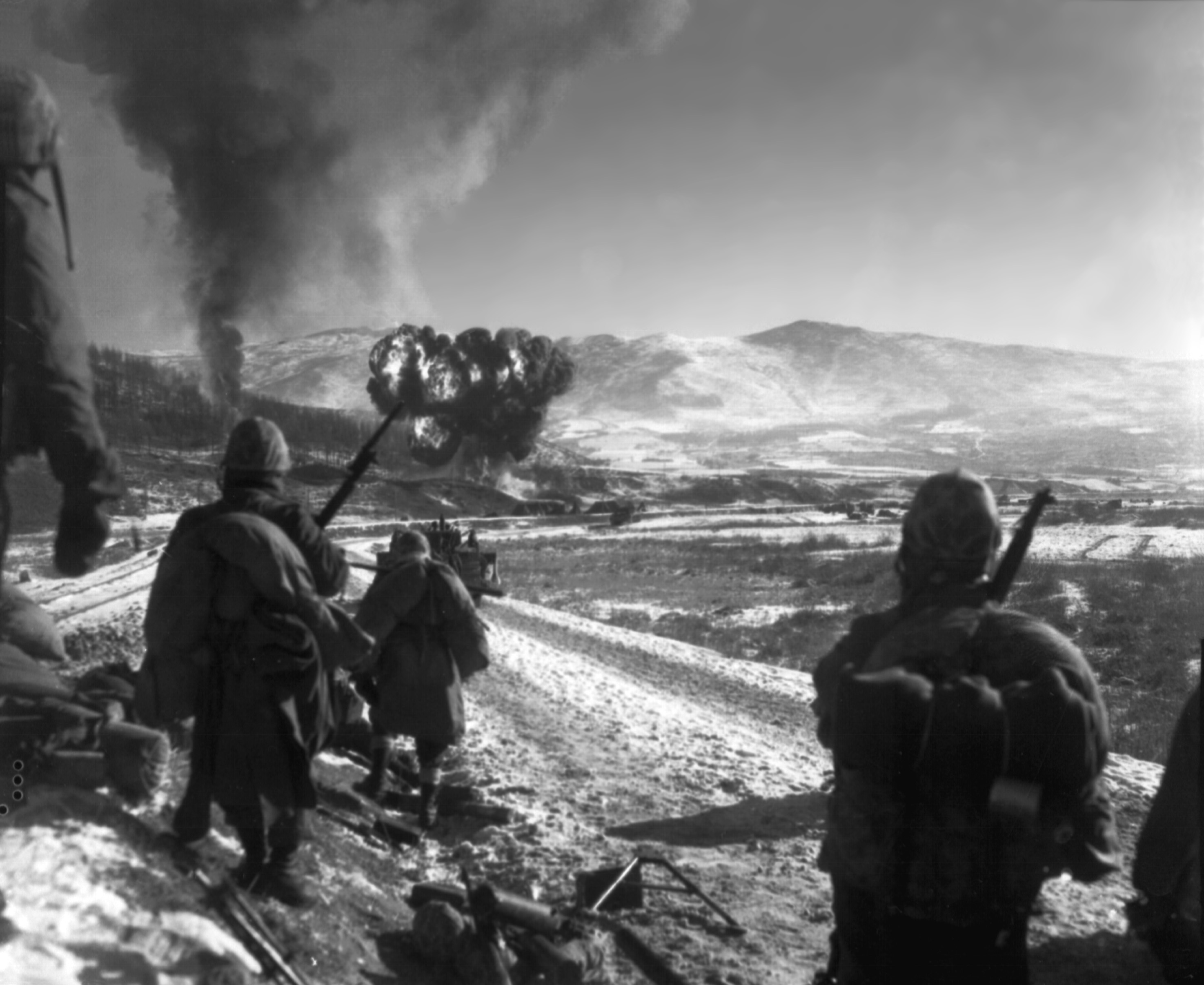 26 December 1950 US Marines move forward after air support hits the enemy in the hills