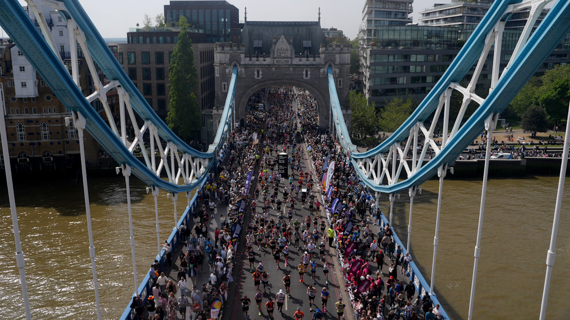 Runners taking part in the London Marathon crossing Tower Bridge