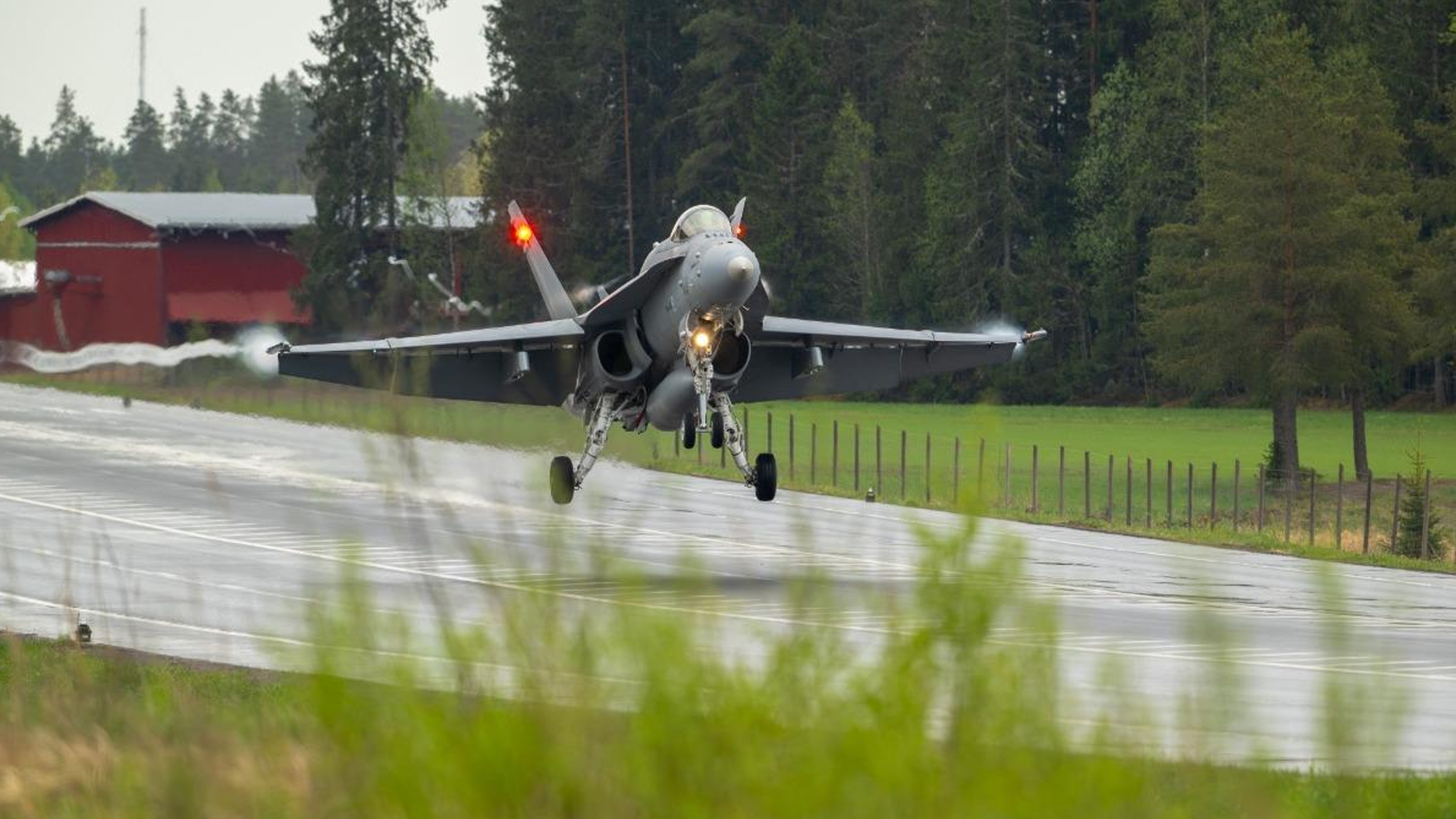 A Finnish F/A-18 Hornet lands on a closed stretch of highway in Finland during the Imminent Field 2026 exercise CREDIT NATO