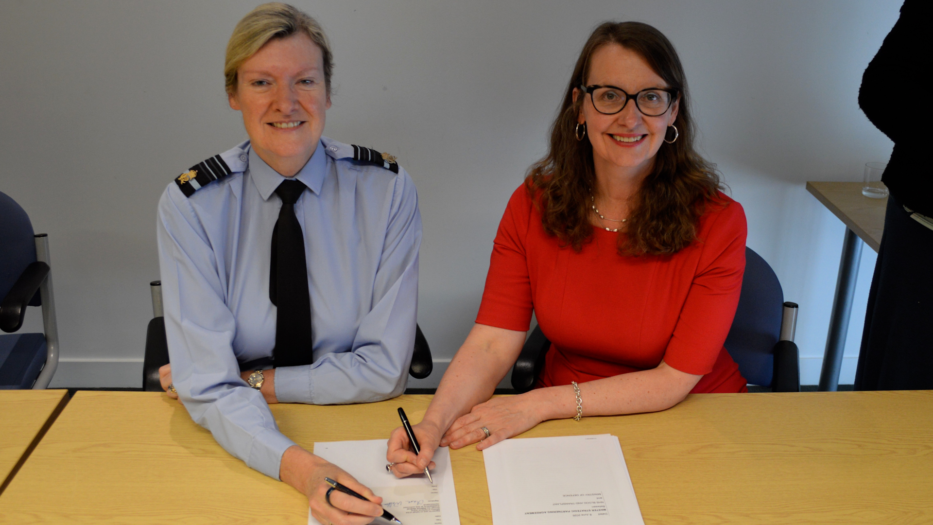 Frances O'Callaghan signing the NHS Blood Transfusion agreement with Air Marshal Claire Walton Chief Defence Medical