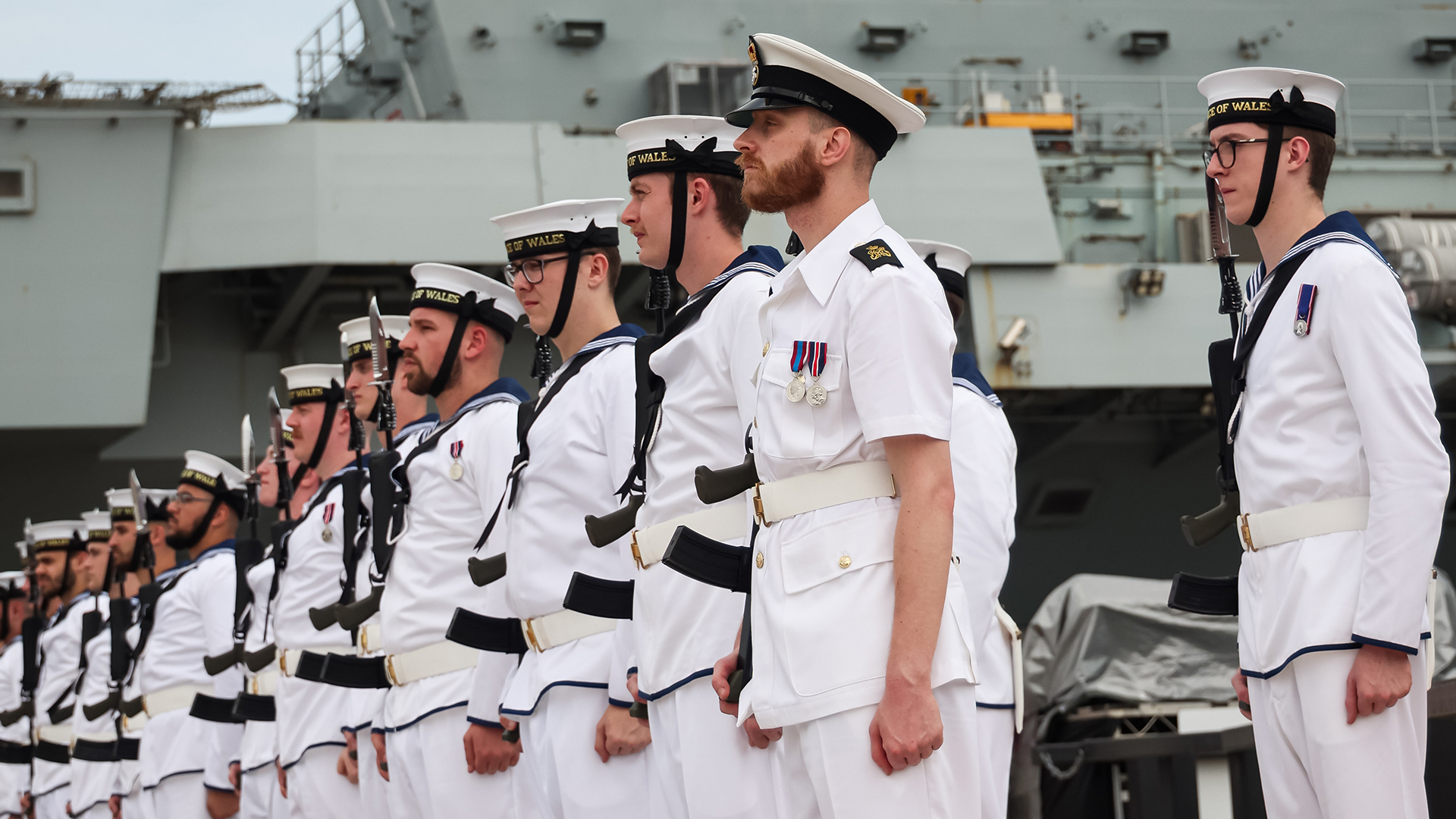 Members of the ship's company form a guard of honour with bayonets fixed to their SA80 L85 rifles