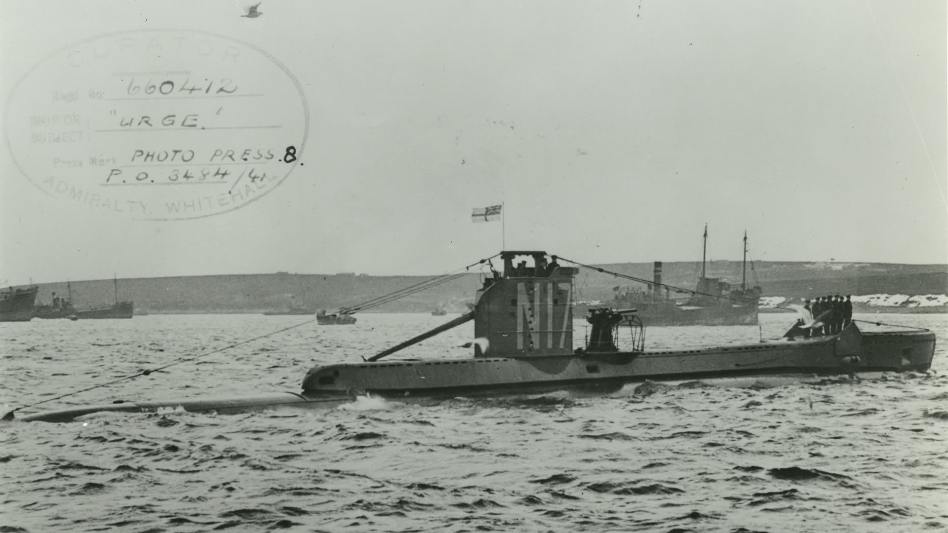 HMS Urge Admiralty old black and white post card with a bird flying 