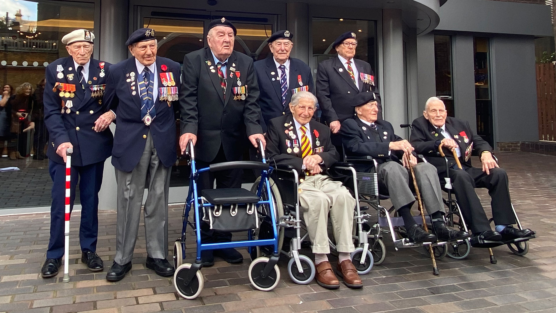 D-Day veterans, including Don Howkins (left of the front row), pictured at the Union Jack Club in London, April 2024 (Picture: Jane Franklin)