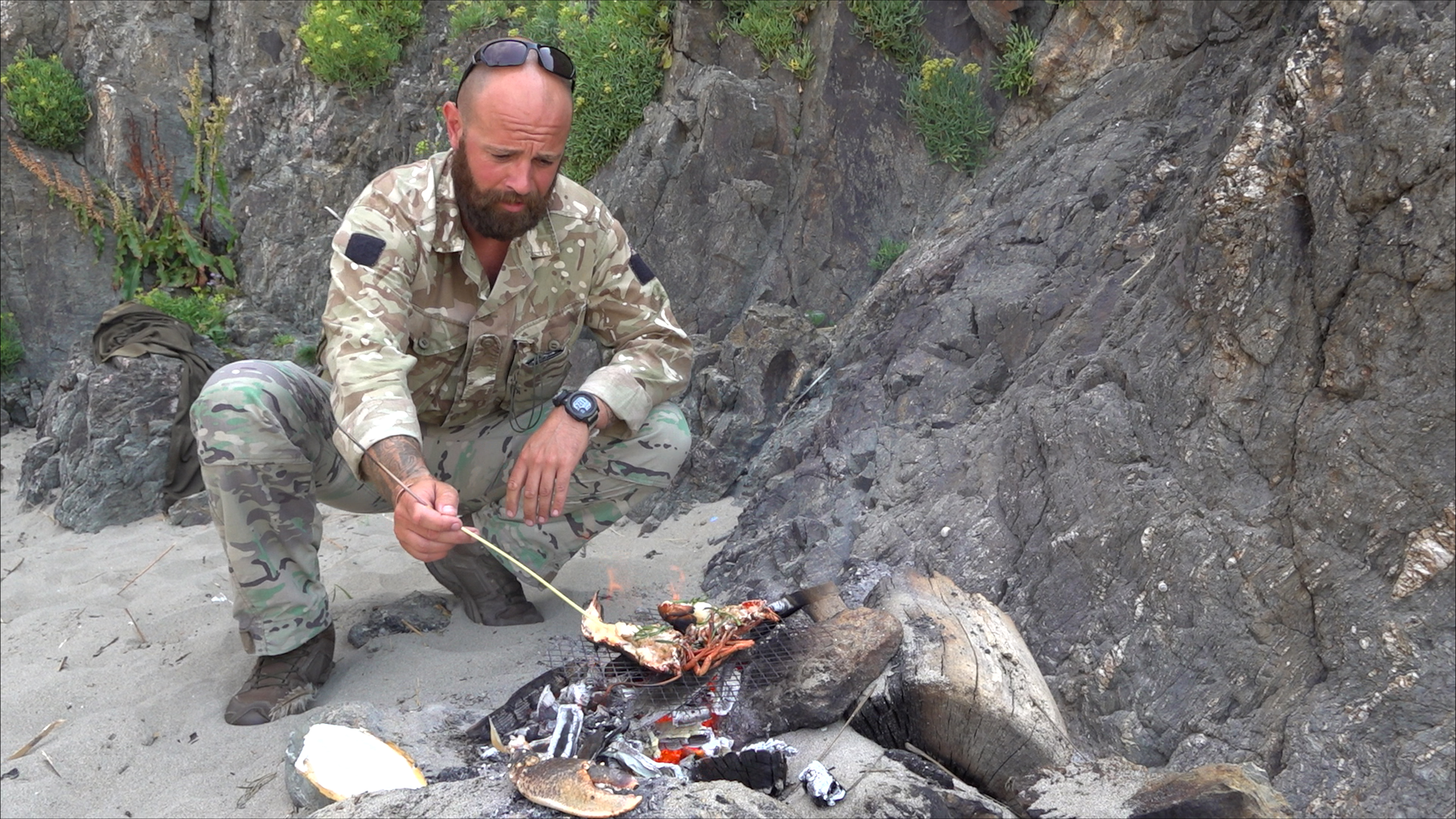 Colour Sergeant Aaron Jones from DSTO cooks a lobster after dispatching it humanely  (Picture: BFBS)