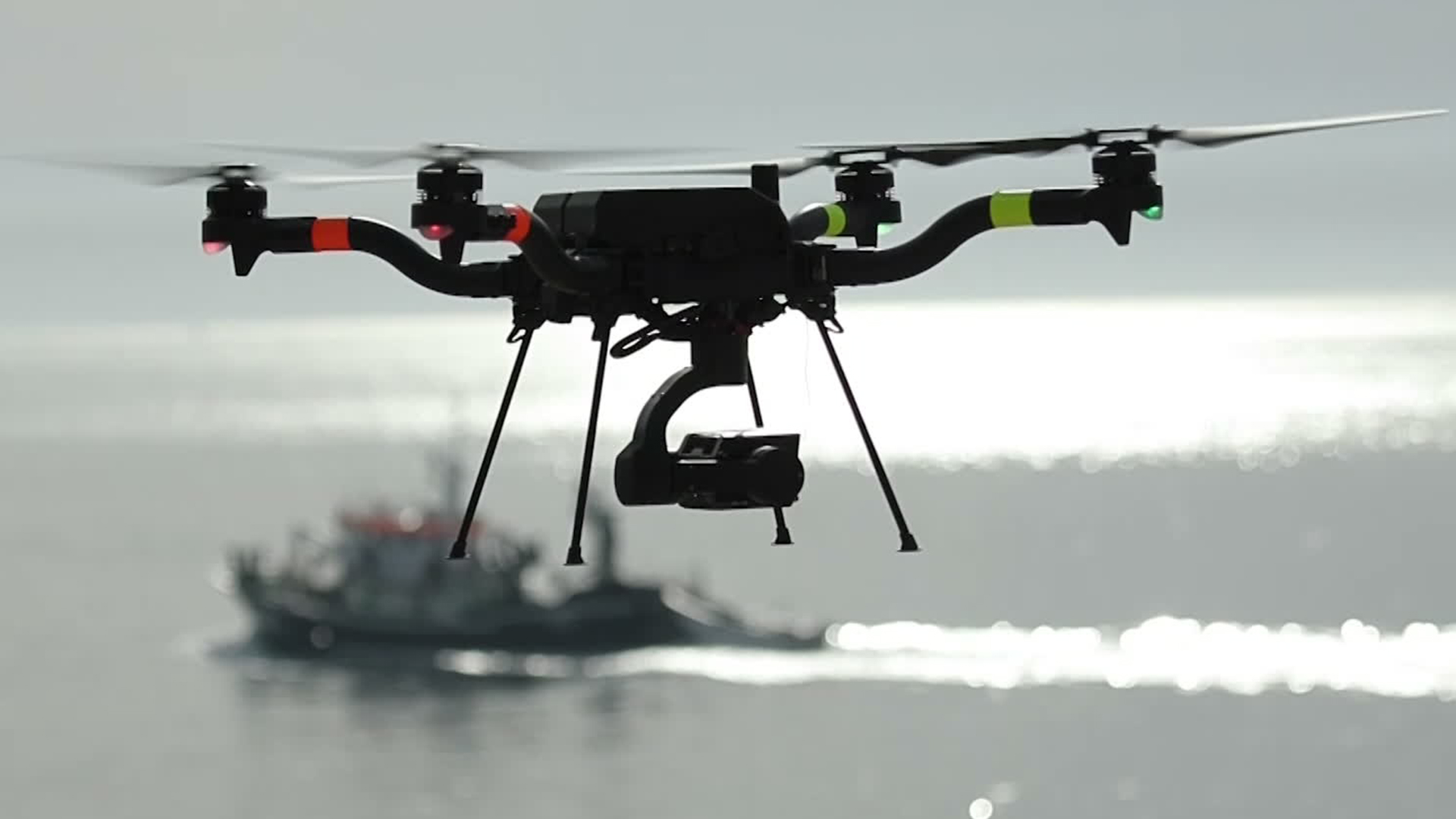 This drone and warship symbolise the multi-domain nature of modern warfare - and the importance of cyber security