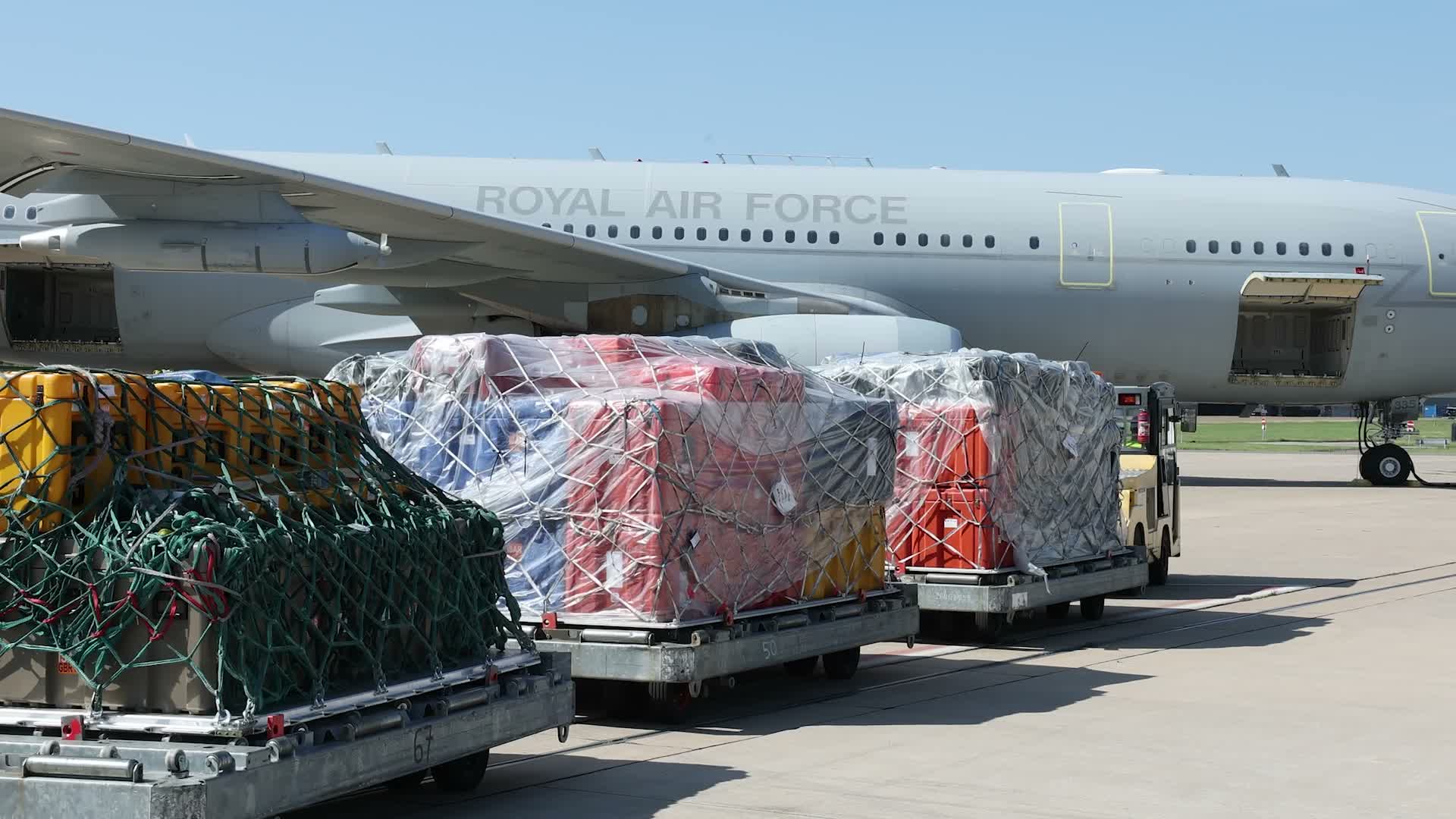  RAF Movers from No.1 Air Mobility Wing build up pallets of humanitarian aid and specialist equipment
