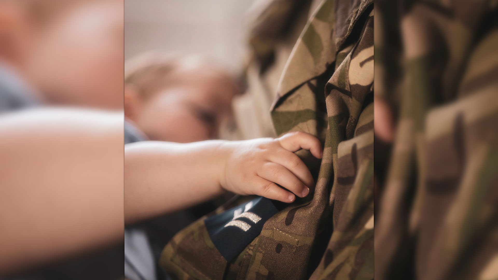 The child of a serving soldier is pictured breastfeeding at the Royal Military Academy Sandhurst (Picture: MOD)