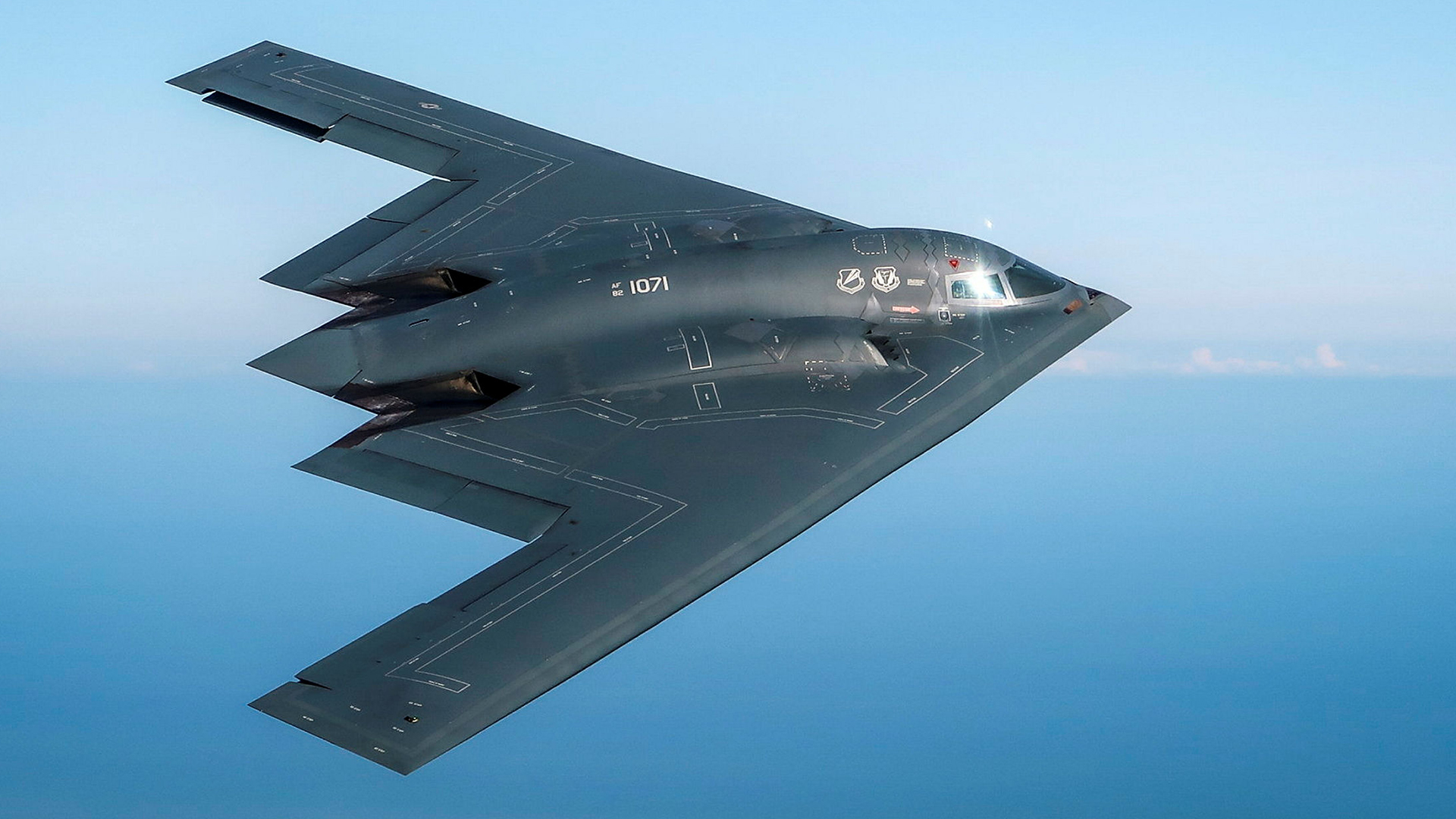 A B-2 Spirit stealth bomber, deployed to RAF Fairford in 2019, flies above the English countryside near Dover