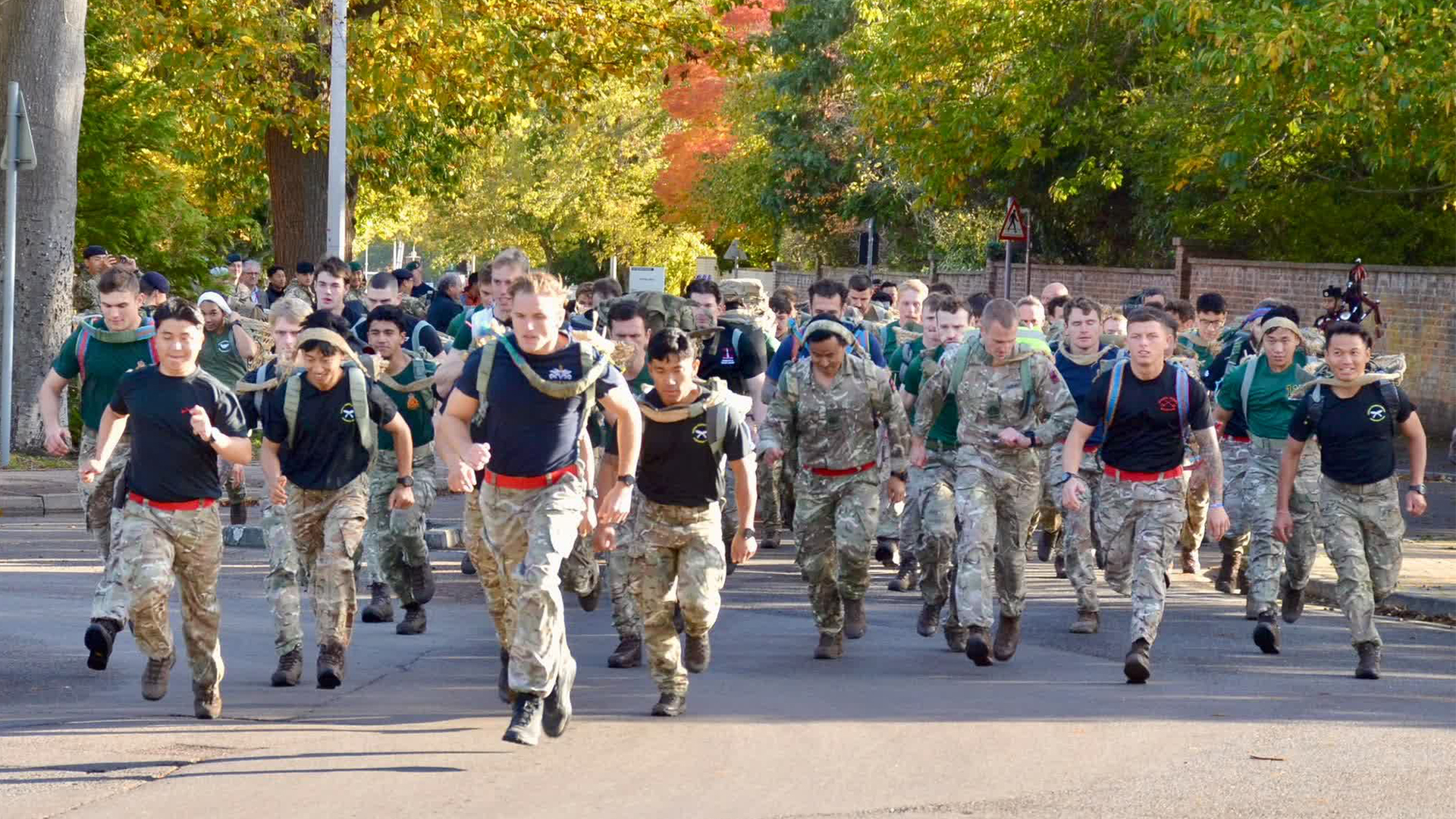 A Gurkha piper was on hand to help urge on the competitors as they ran weighted down through ATC Pirgright (Picture: BFBS)