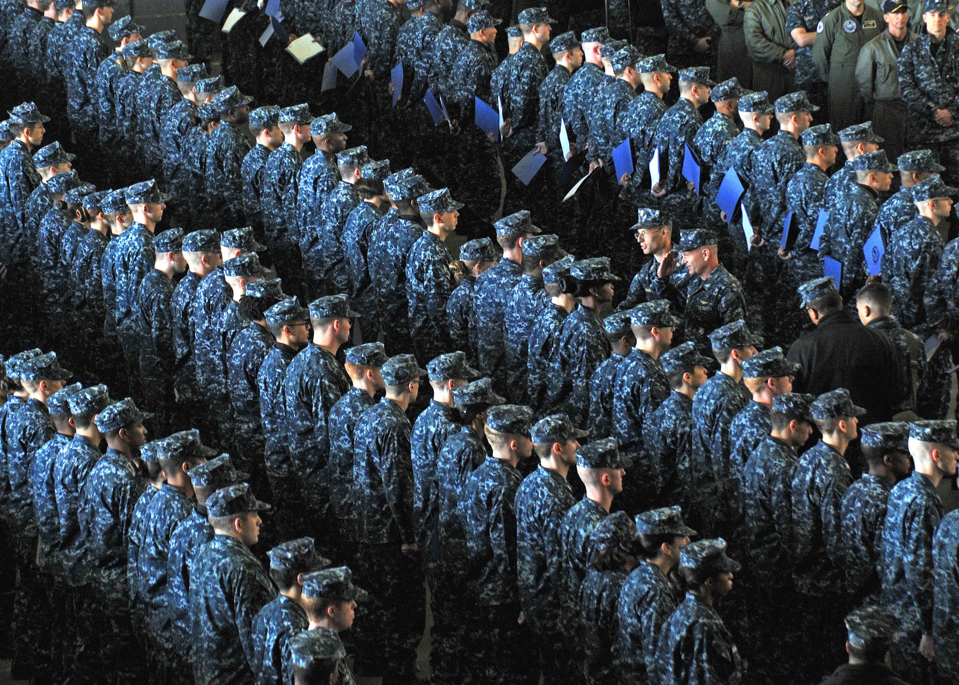 Newly-promoted Petty Officers stand in formation aboard the U.S. Navy's forward deployed aircraft carrier USS George Washington (Picture: US Navy/R.G.Go )