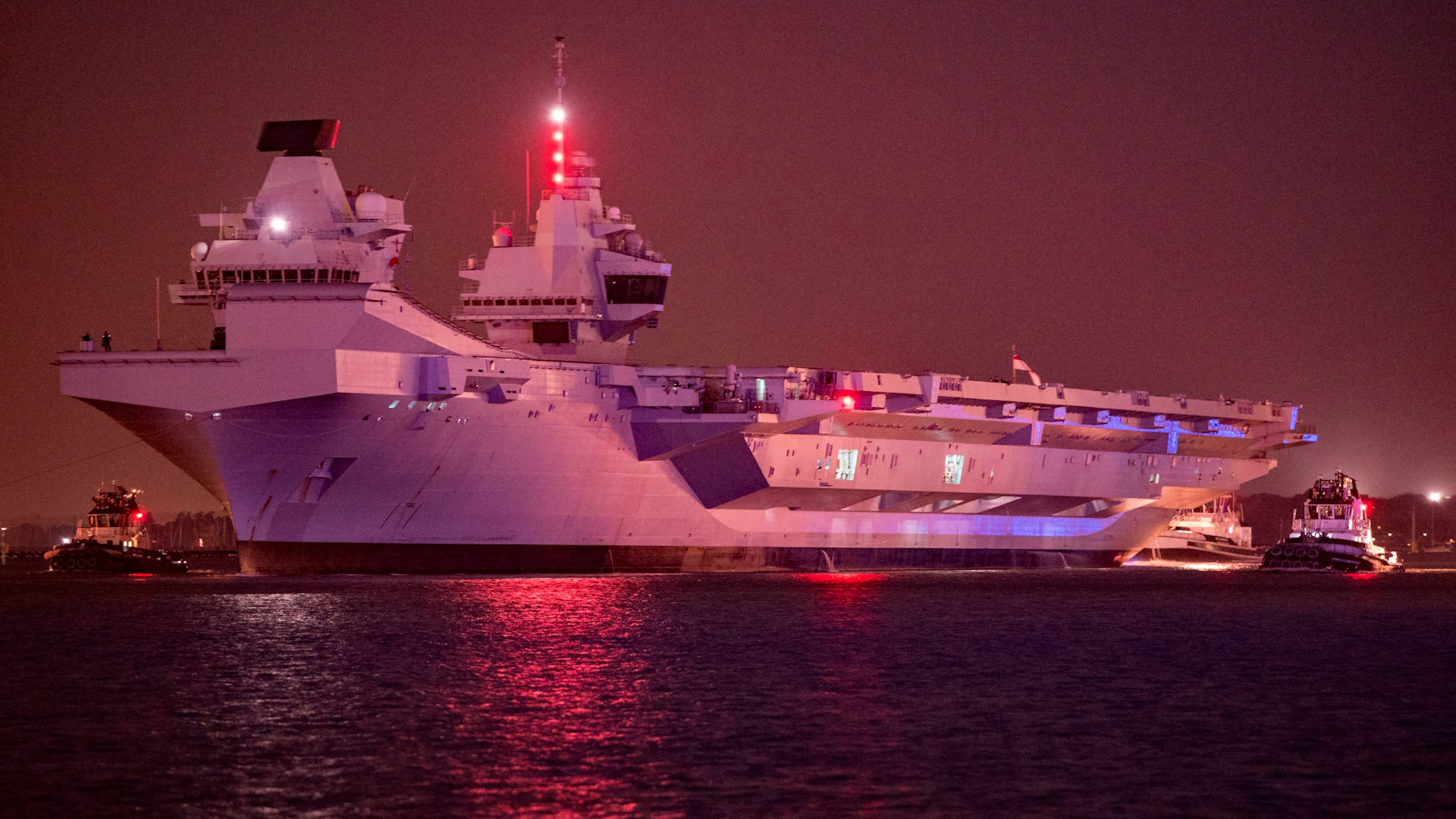 HMS Prince of Wales leaving Portsmouth, UK for repairs