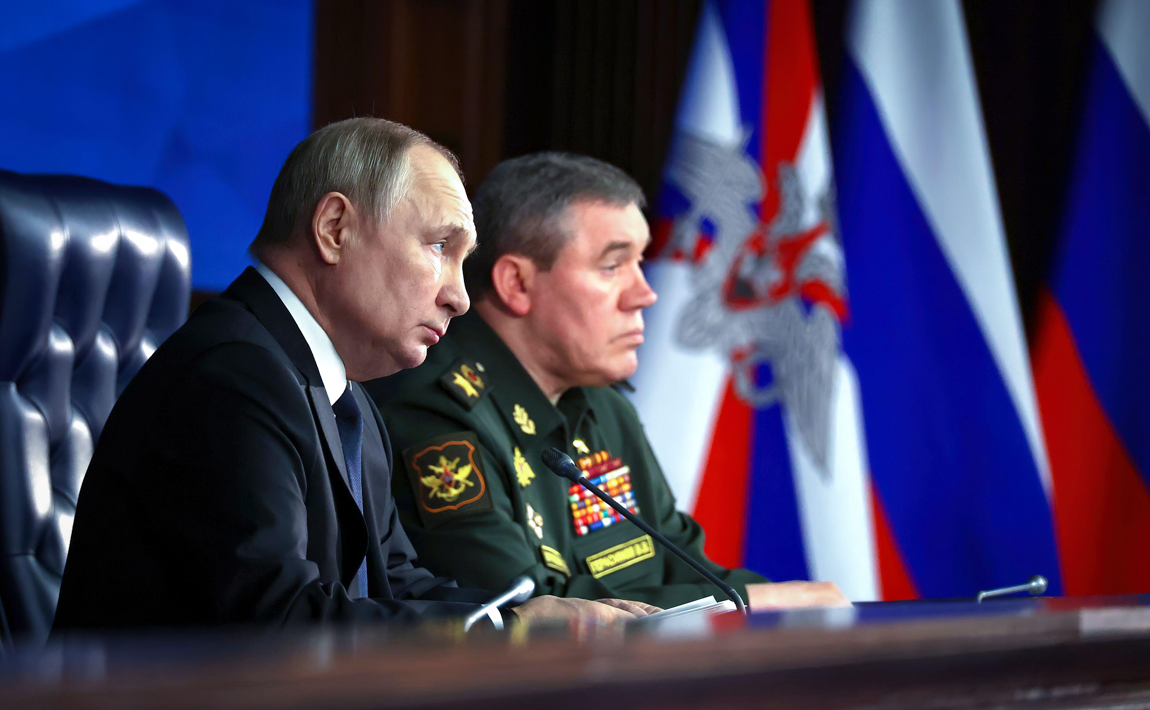Russian President Vladimir Putin Vladimir Putin alongside General Staff of the Russian Armed Forces Valery Gerasimov