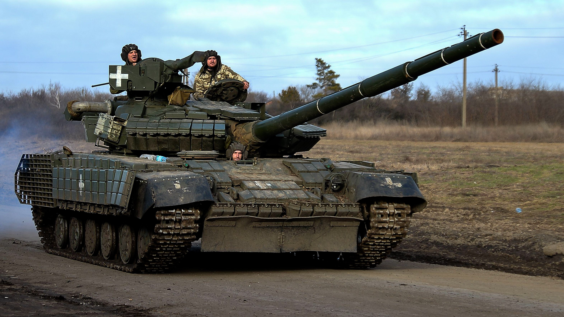 A Ukraine tank crew drives through roads near the city of Avdiivka as the Ukrainian army retreats from Avdiivka.