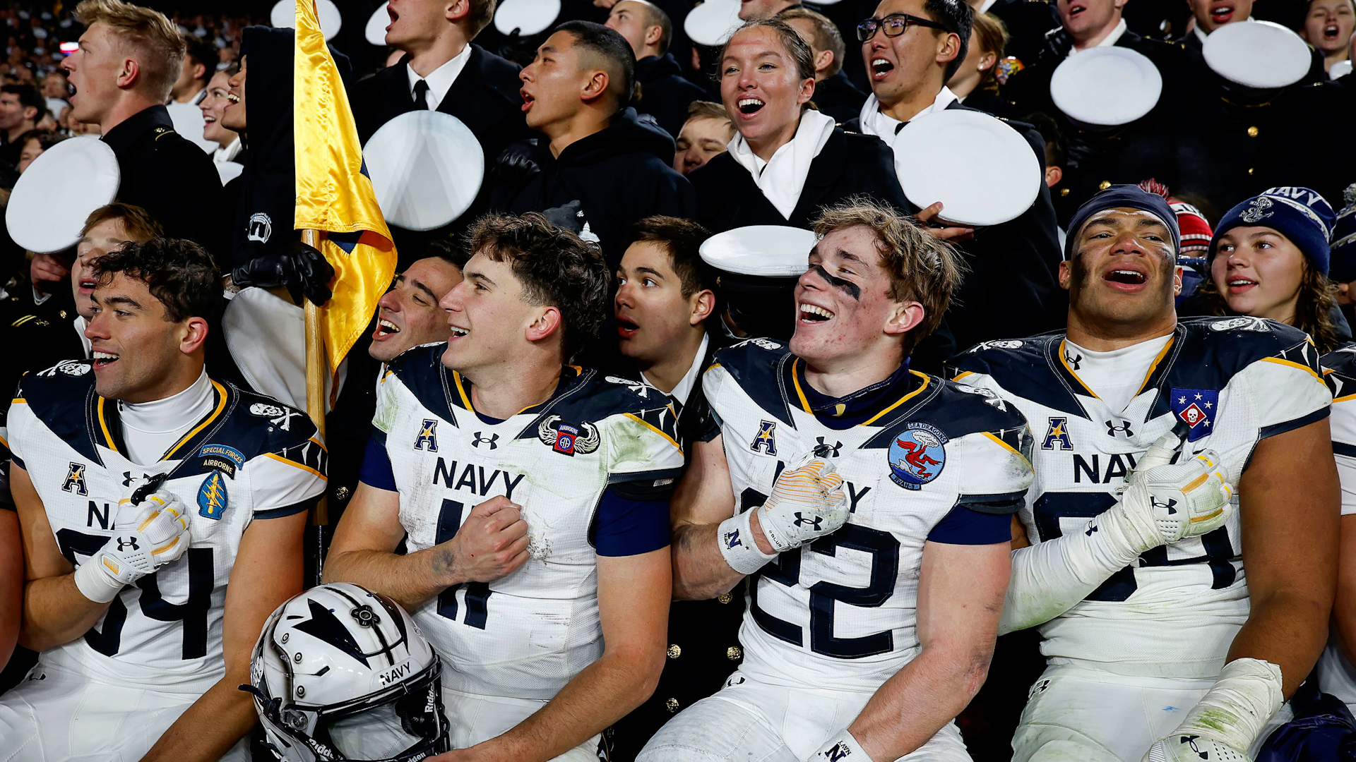 2YXA3CB Navy personnel sing the USNA Alma Mater, Navy Blue and Gold, after winning the NCAA football game between the US Army and Navy 151224 CREDIT Alamy