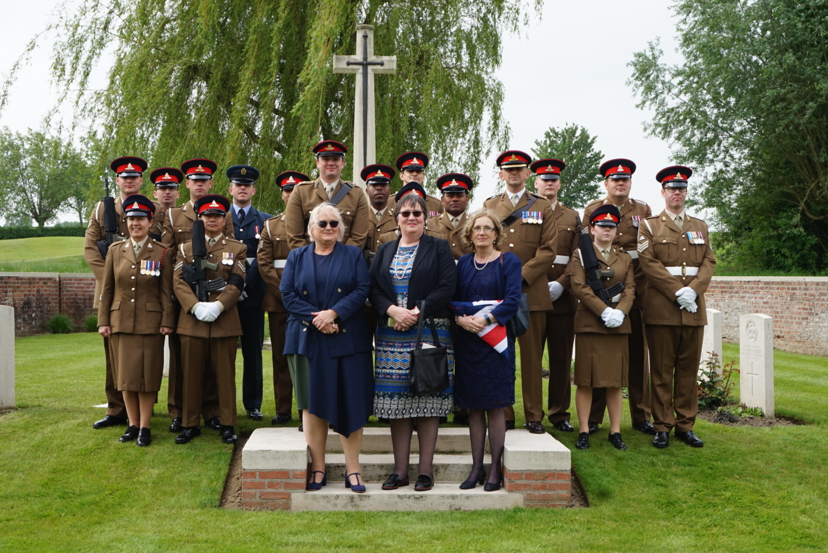 2nd Lt. Henderson’s great nieces (l to r) Judith Leyman, Sarah Foot and Lucy Cocup stand with the Royal Artillery Regiment and military representatives (Crown Copyright)