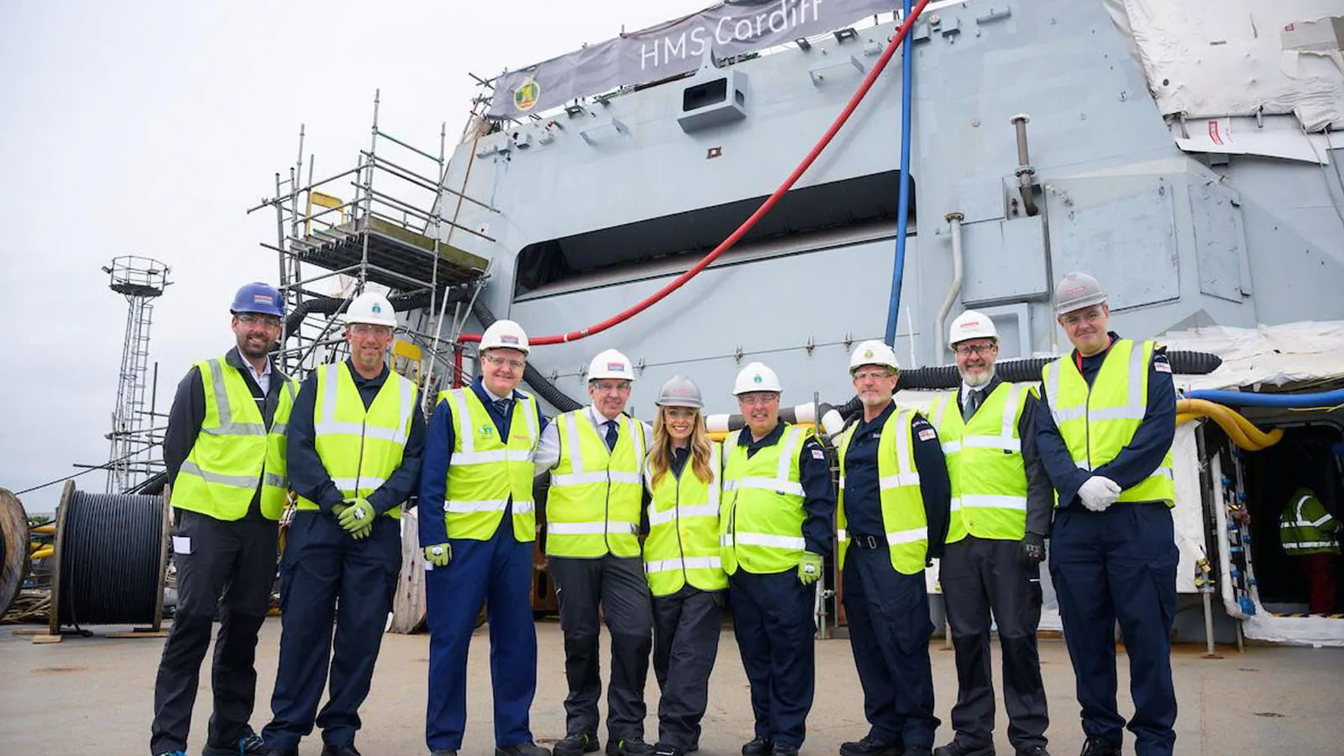 Katherine Jenkins poses with crew and BAE staff on HMS Cardiffs flight deck