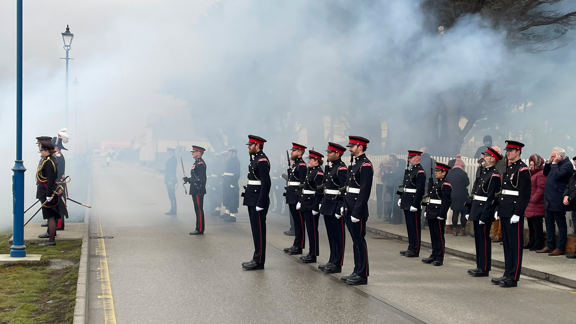 In addition to some light rain, those on parade were treated to the gunsmoke wafting over them (Picture: Gavin Phillip Short)