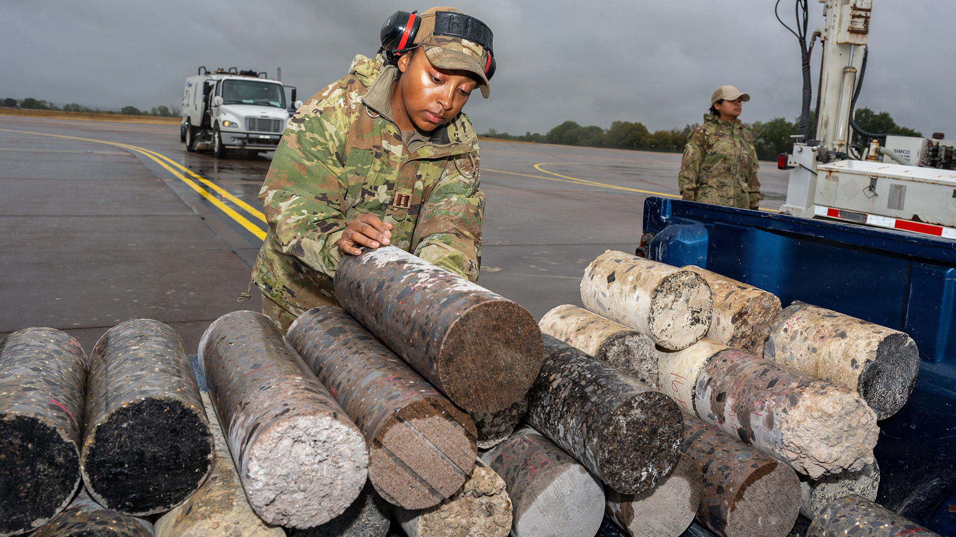 Captain Andi Brown, a US Air Force Civil Engineer Centre Airfield Pavement Evaluation Team officer, stacks pavement cores at RAF Fairford (Picture: US Department of War)