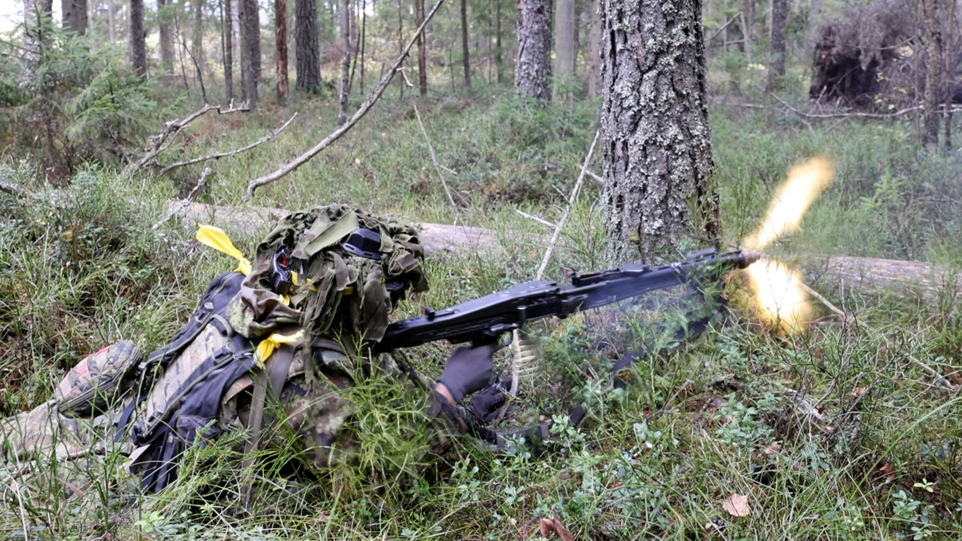 The exercise involved infantry as well as armour - this Estonian soldier opens fire on the Red Force with his MG 3 machine gun