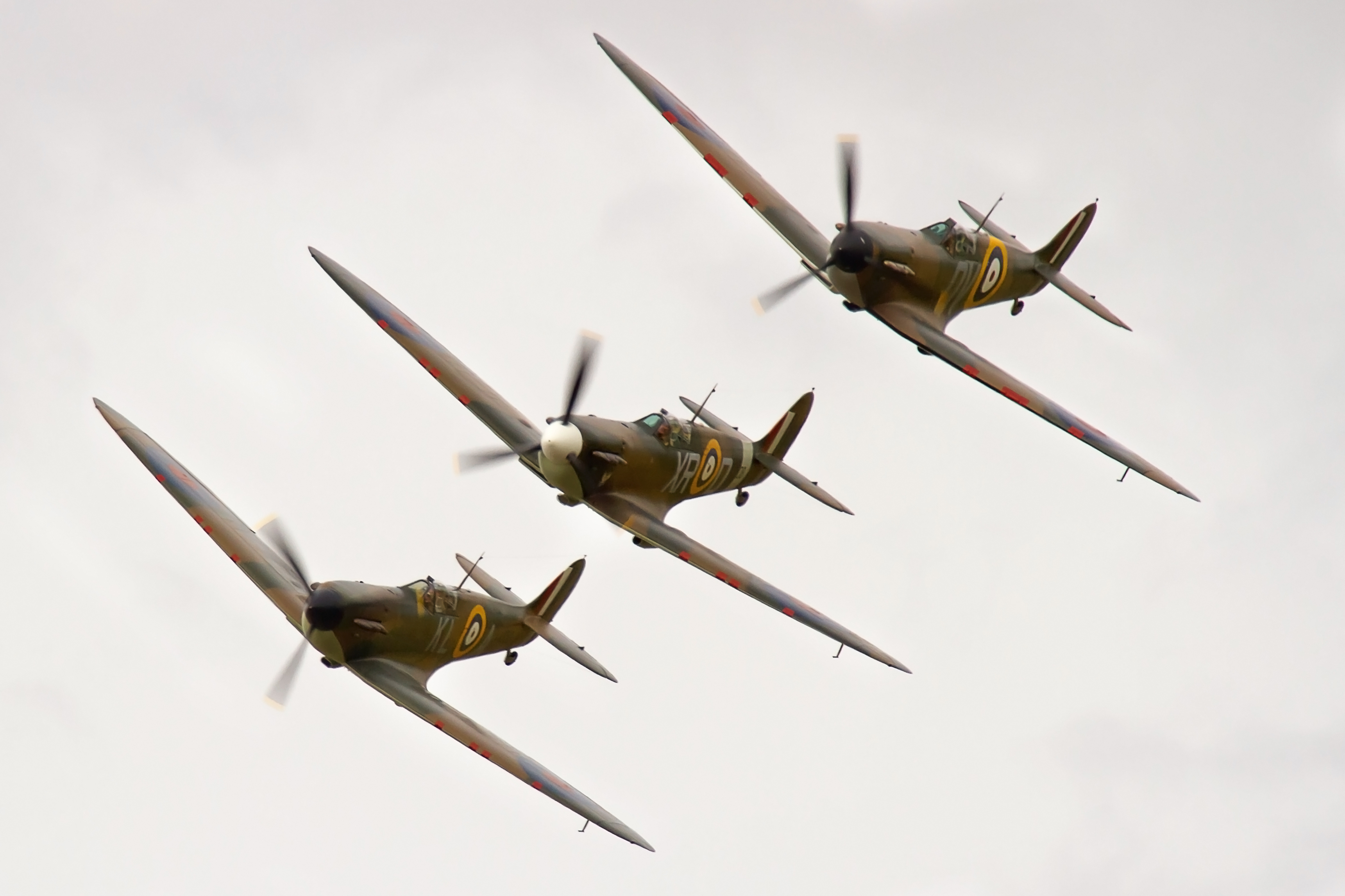 3 Spitfires flying in a line.