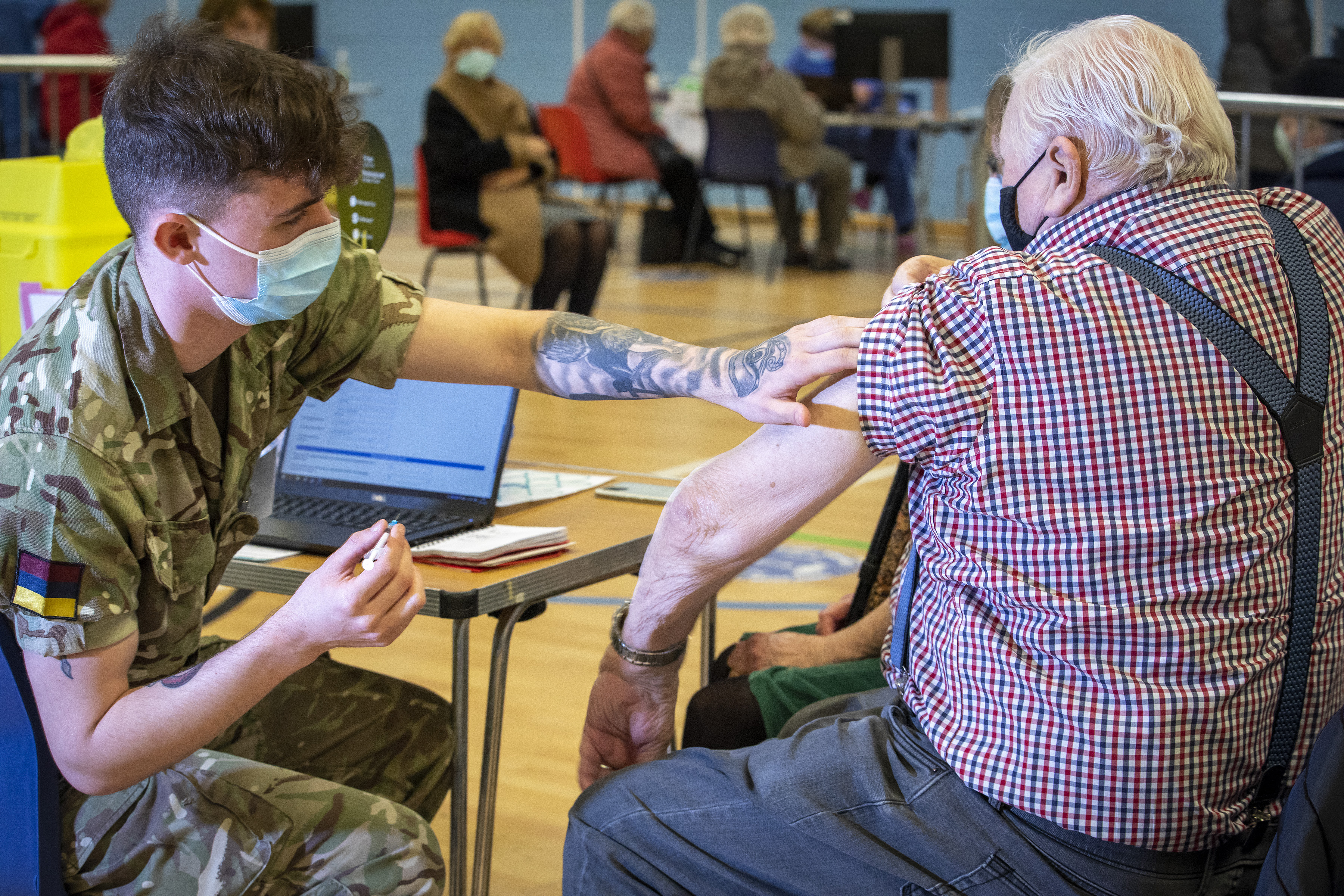Cover image: Military personnel vaccinating at a centre in Cwmbran, South Wales (Picture: MOD).