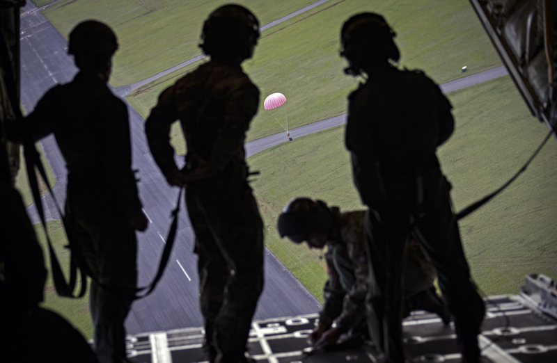 RAF crew watch the ‘brolly’ open as a load is dropped from a C130J Hercules. Credit: Cpl Lee Matthews RAF, Crown Copyright
