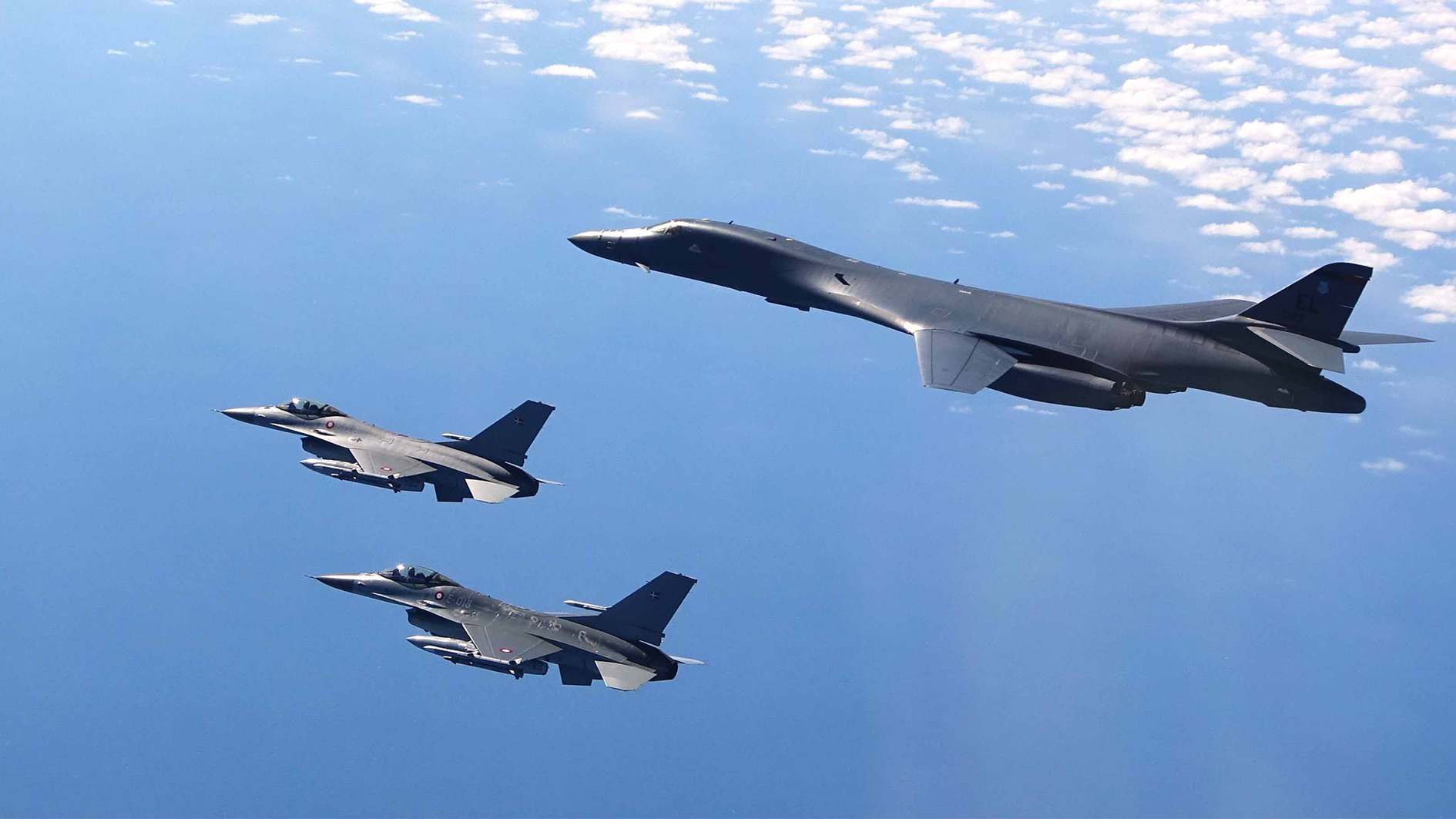 A B-1B Lancer flies with two Danish F-16s during a training mission for Bomber Task Force Europe, May 5, 2020. CREDIT DANISH AIR FORCE