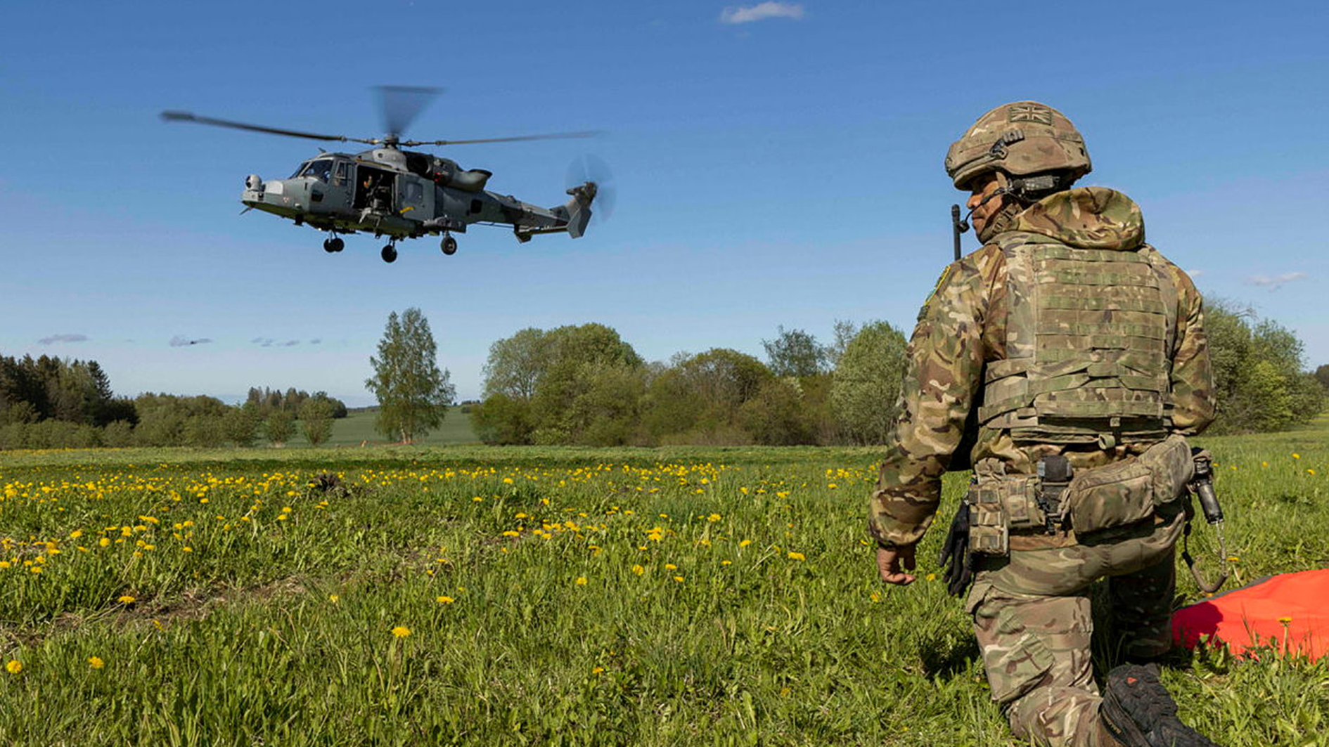 A British Army JTAC communicates with Wildcat helicopter aircrew as they take off. (Picture: MOD)
