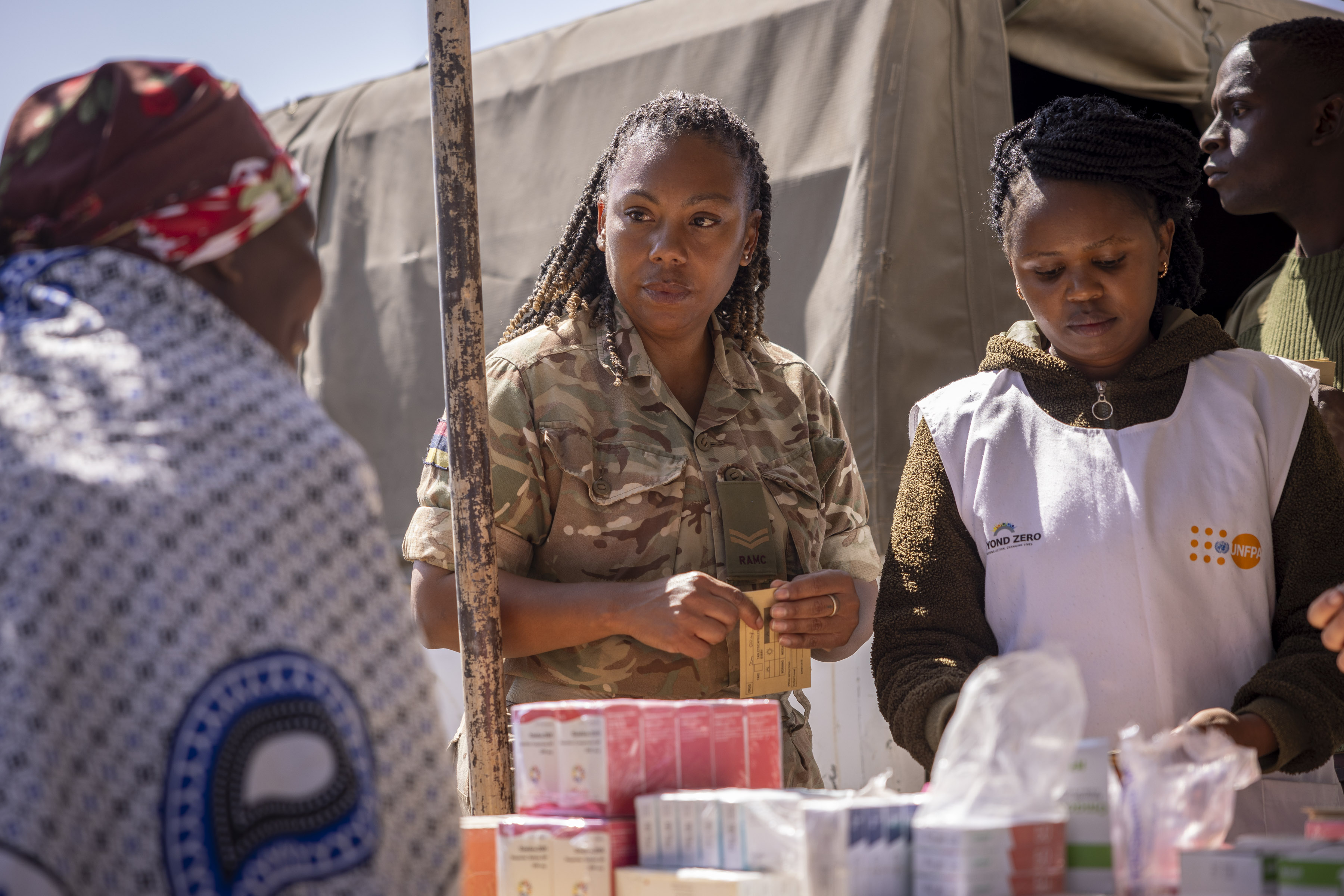 A British soldier consults with medical colleagues at a rural clinic in Kenya (Picture: British Army).