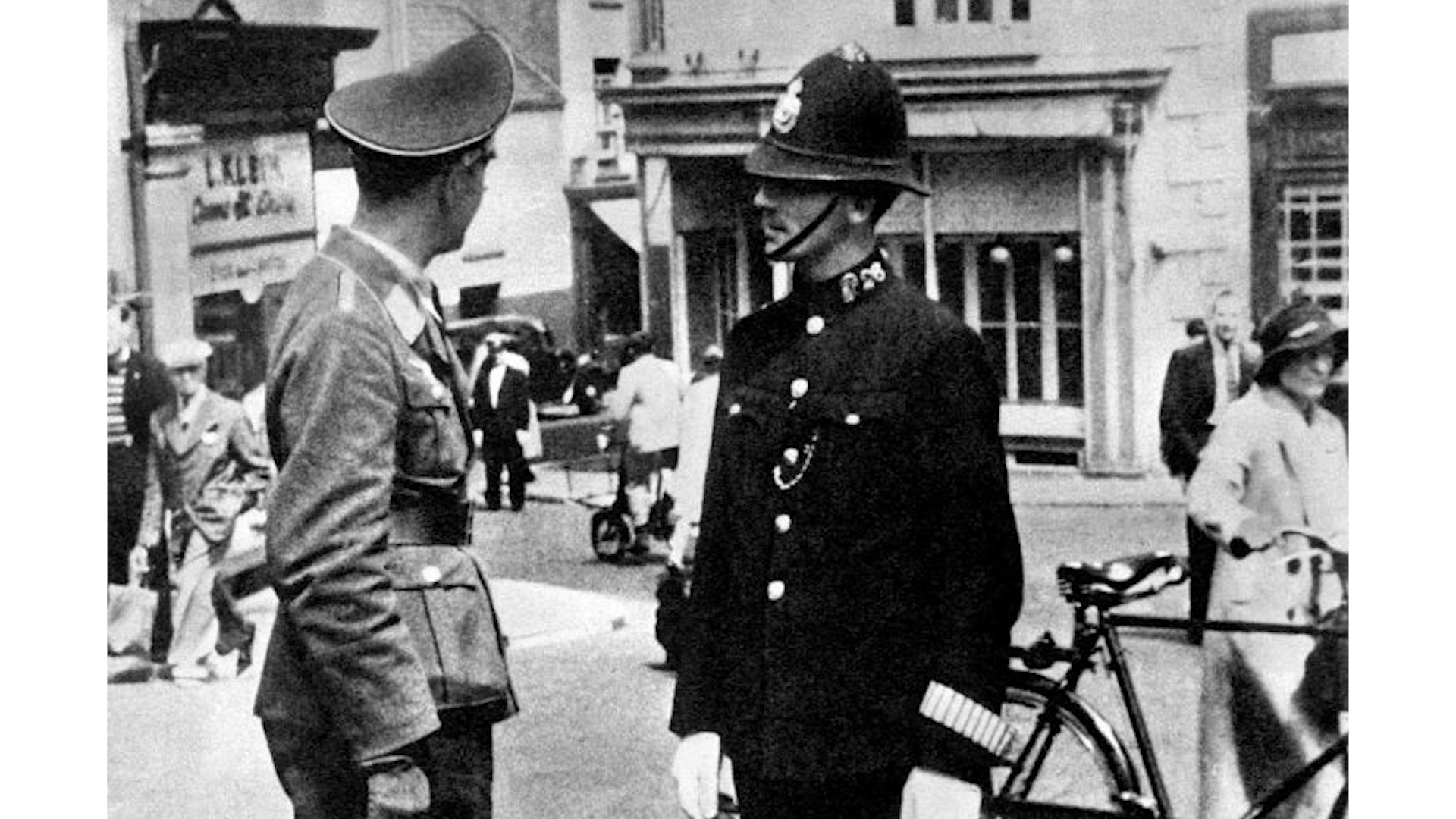 A Luftwaffe officer speaking with a British policeman in St. Helier, the capital of the island of Jersey, during the German occupation of the Channel Islands