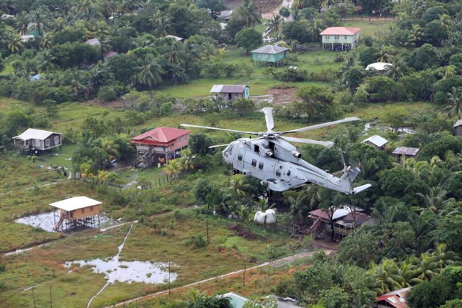 A Merlin helicopter from 845 Naval Air Squadron with an underslung load of humanitarian aid provisions on route to a drop location in Honduras 211120 CREDIT MOD