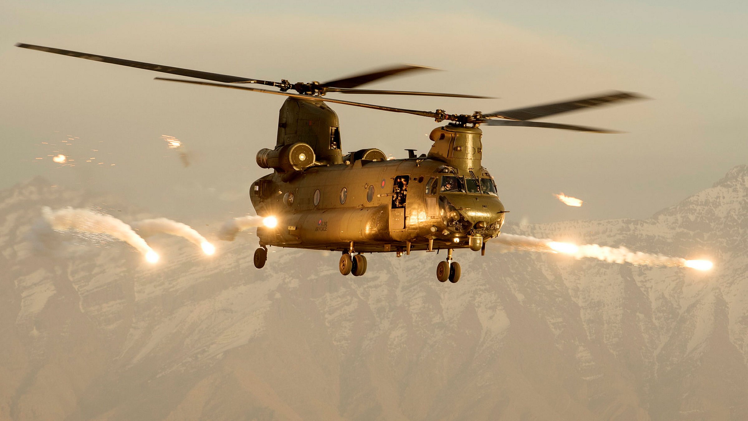 A Royal Air Force Chinook helicopter firing flares over Afghanistan DATE 10012023 CREDIT MOD Crown Copyright.jpg