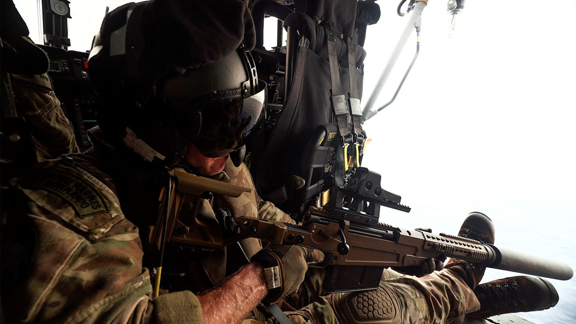 A Royal Marine Commando conducts a live shoot from a Wildcat HMA Mk 2 whilst in the Philippine Sea CREDIT MOD