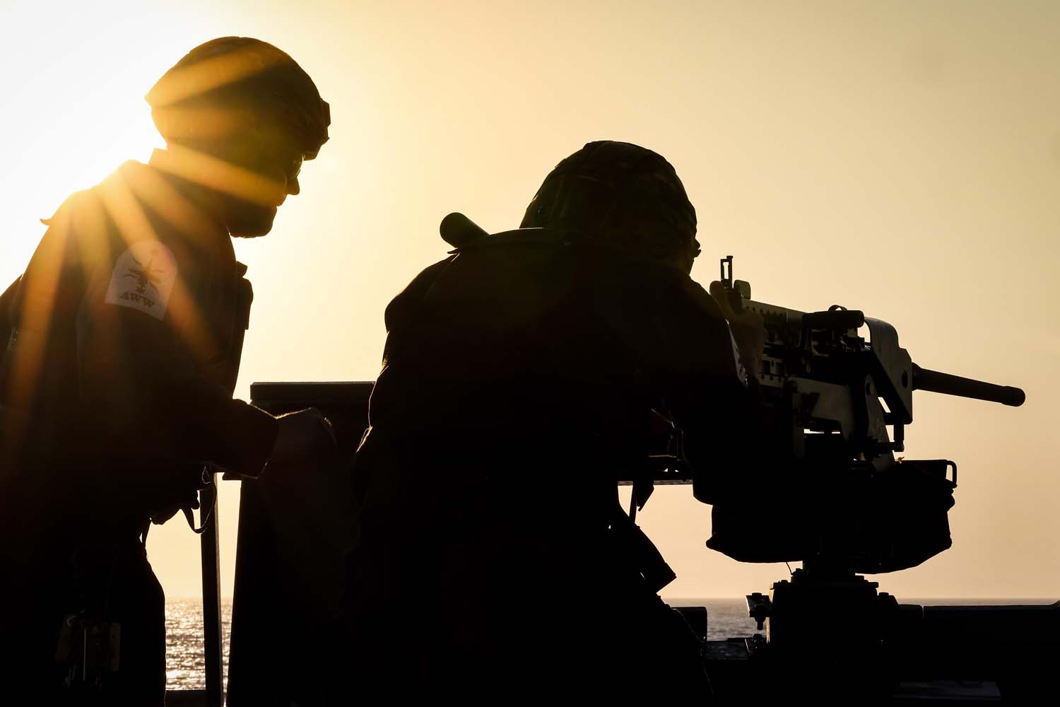 A Royal Navy gunner mans a heavy machine gun during a Mediterranean minefield scenario (Picture: Royal Navy)