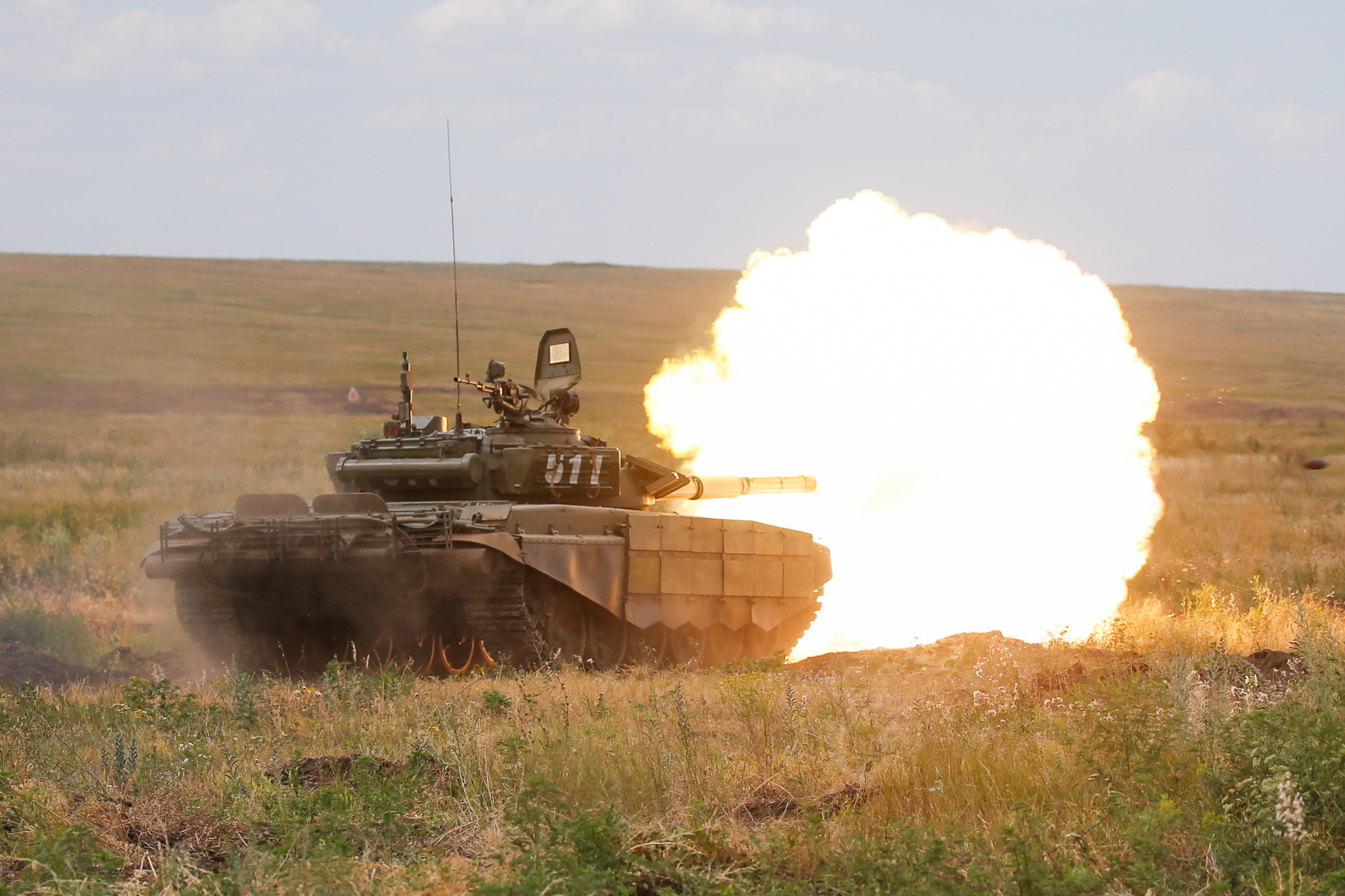 A Russian T-72B3 battle tank firing during an operational readiness check at Kadamovsky range in the Rostov on Don region 