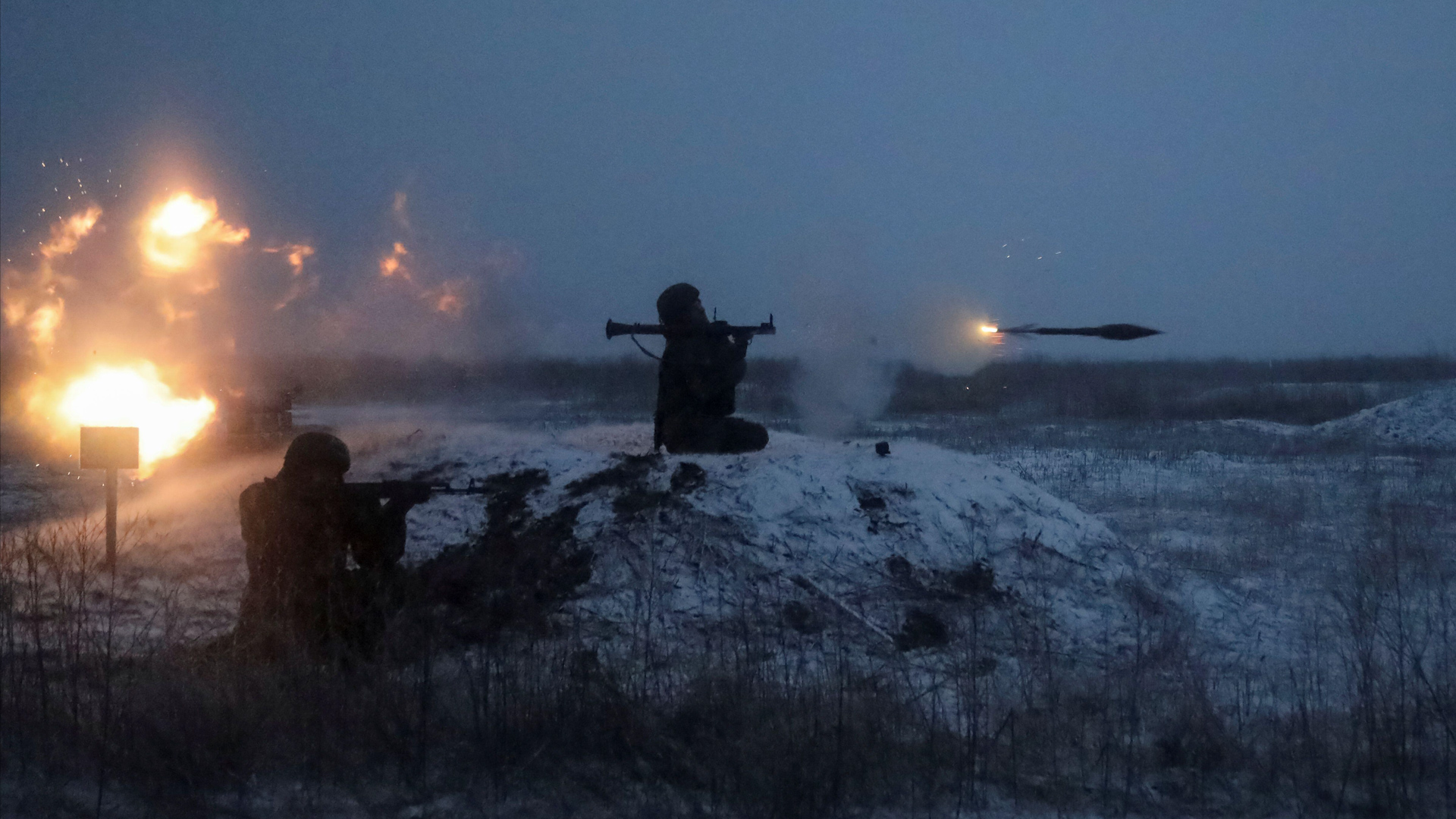 A Russian soldier fires a rocket-propelled grenade launcher during drills near the Ukraine border