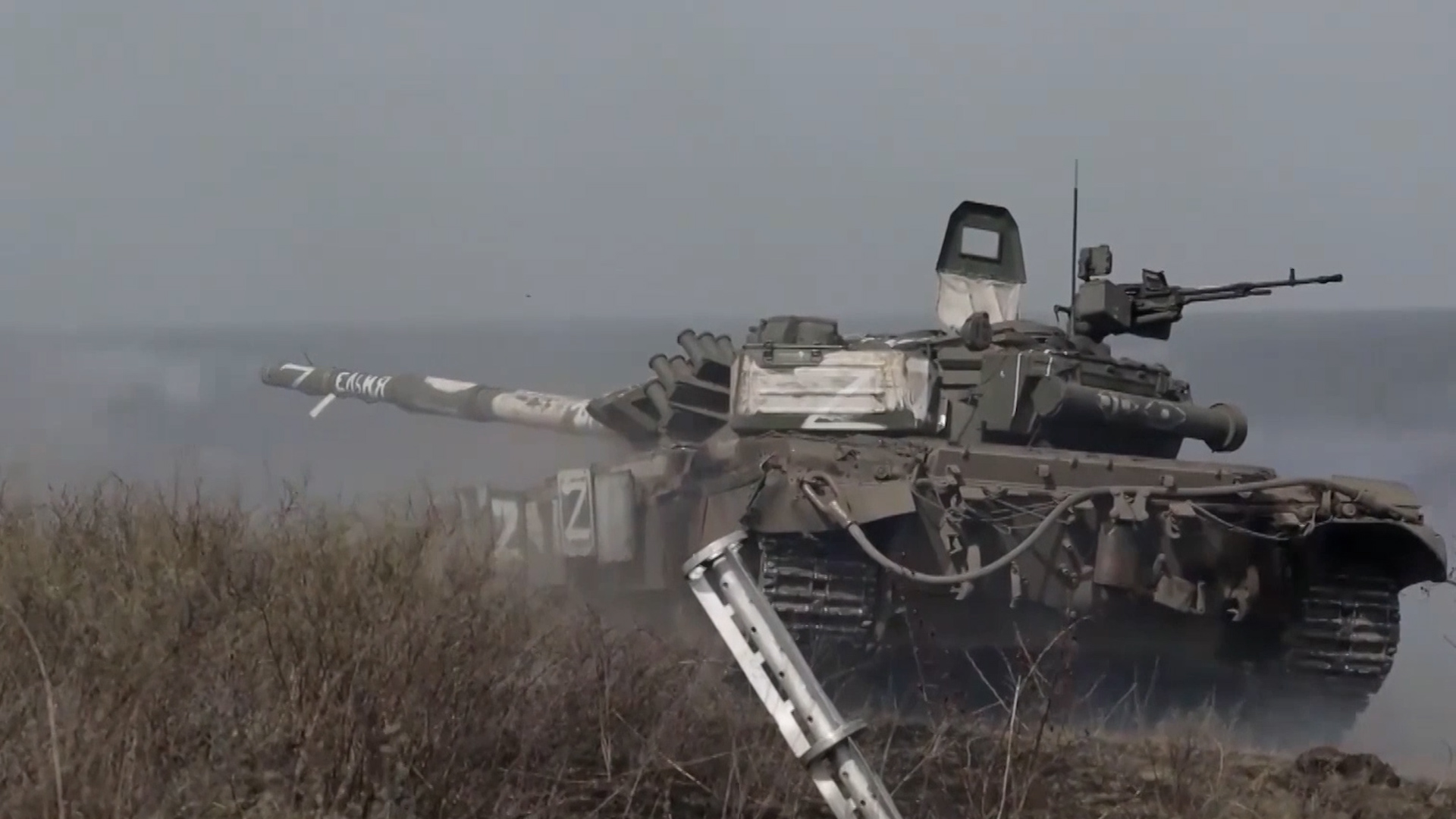 A Russian tank rumbles through terrain amid concerns of a Russian offensive in Donbas (Picture: Russian MOD).